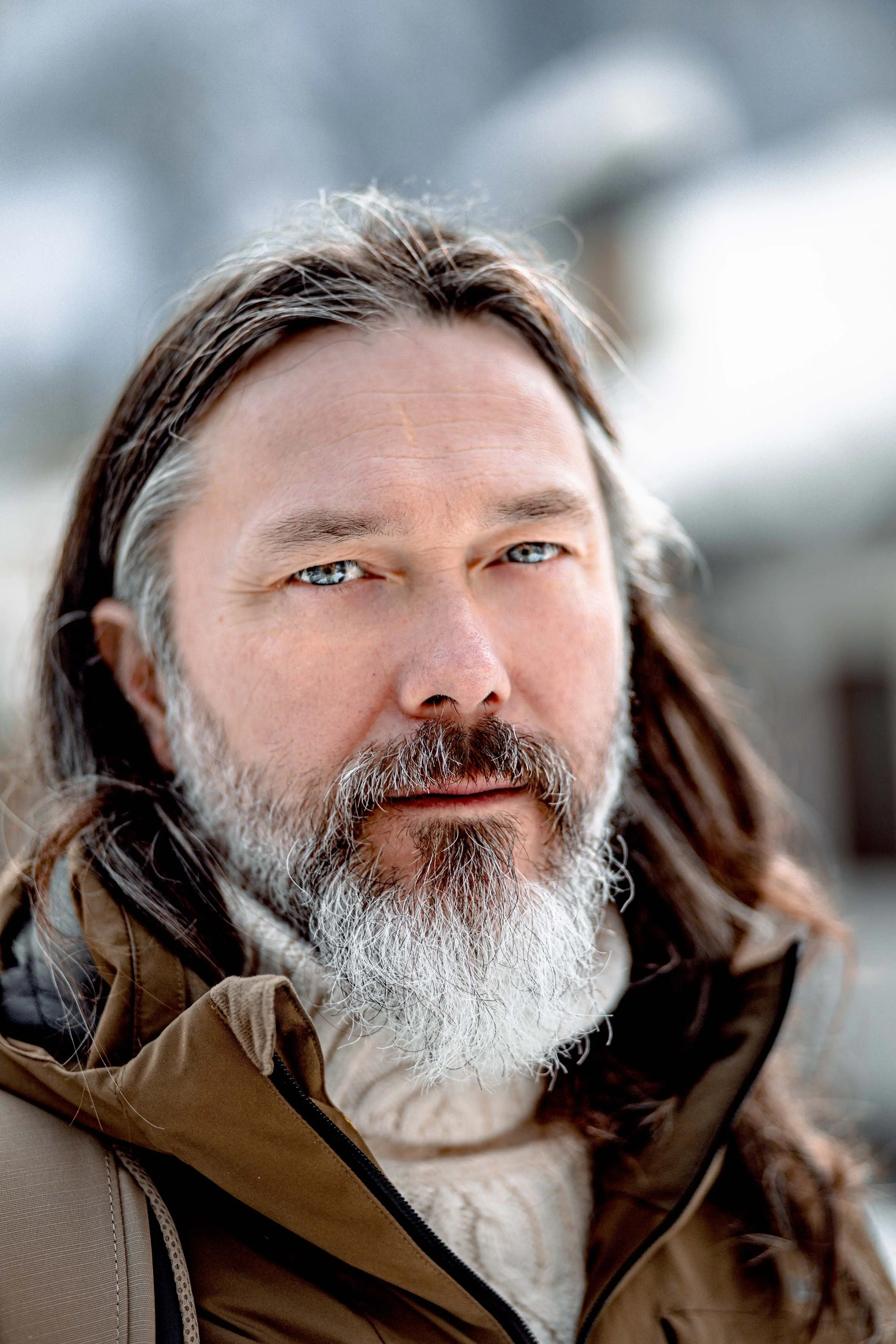 scandinavian man with blue eyes and beard winter time