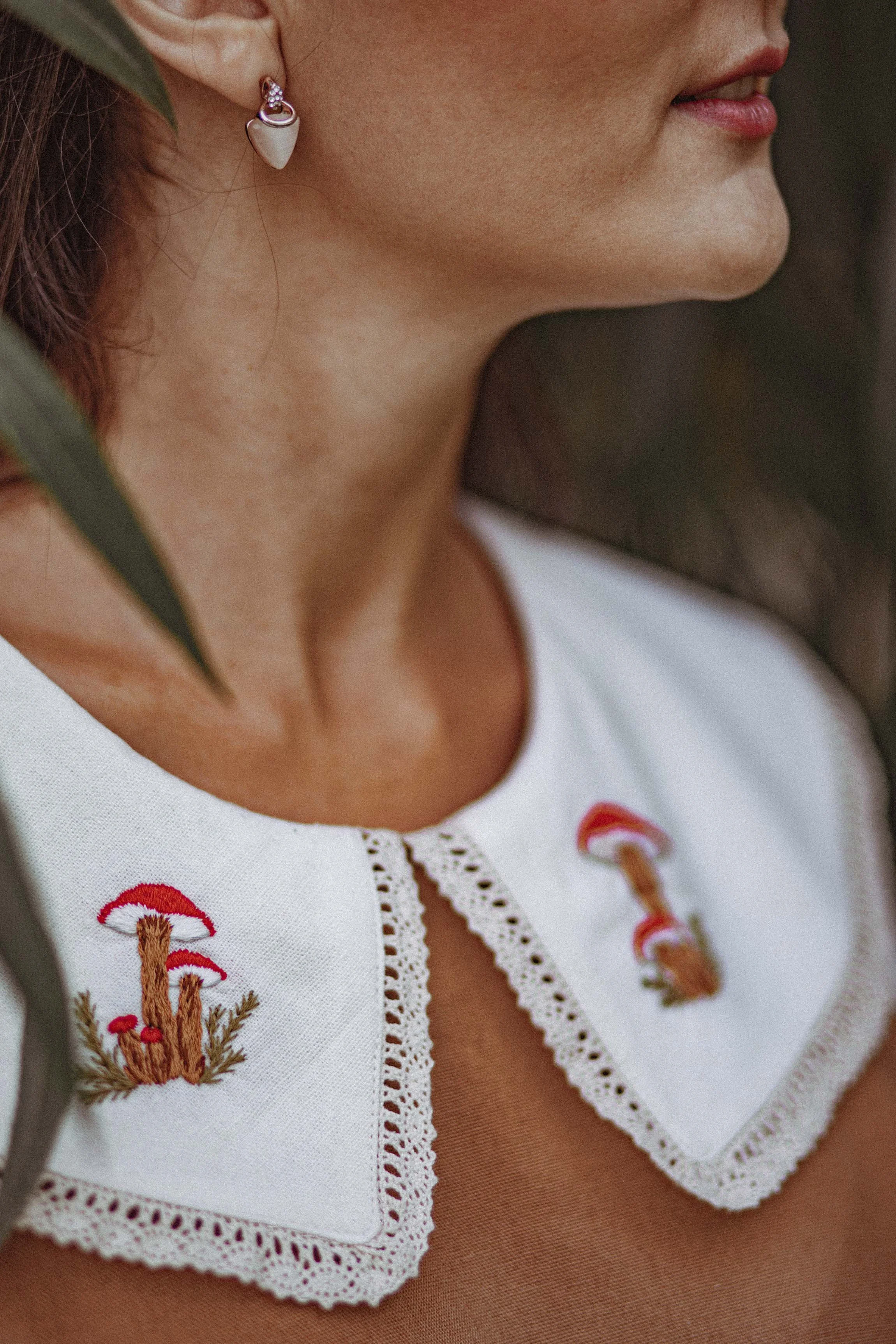 detail a girl with embroidered dress