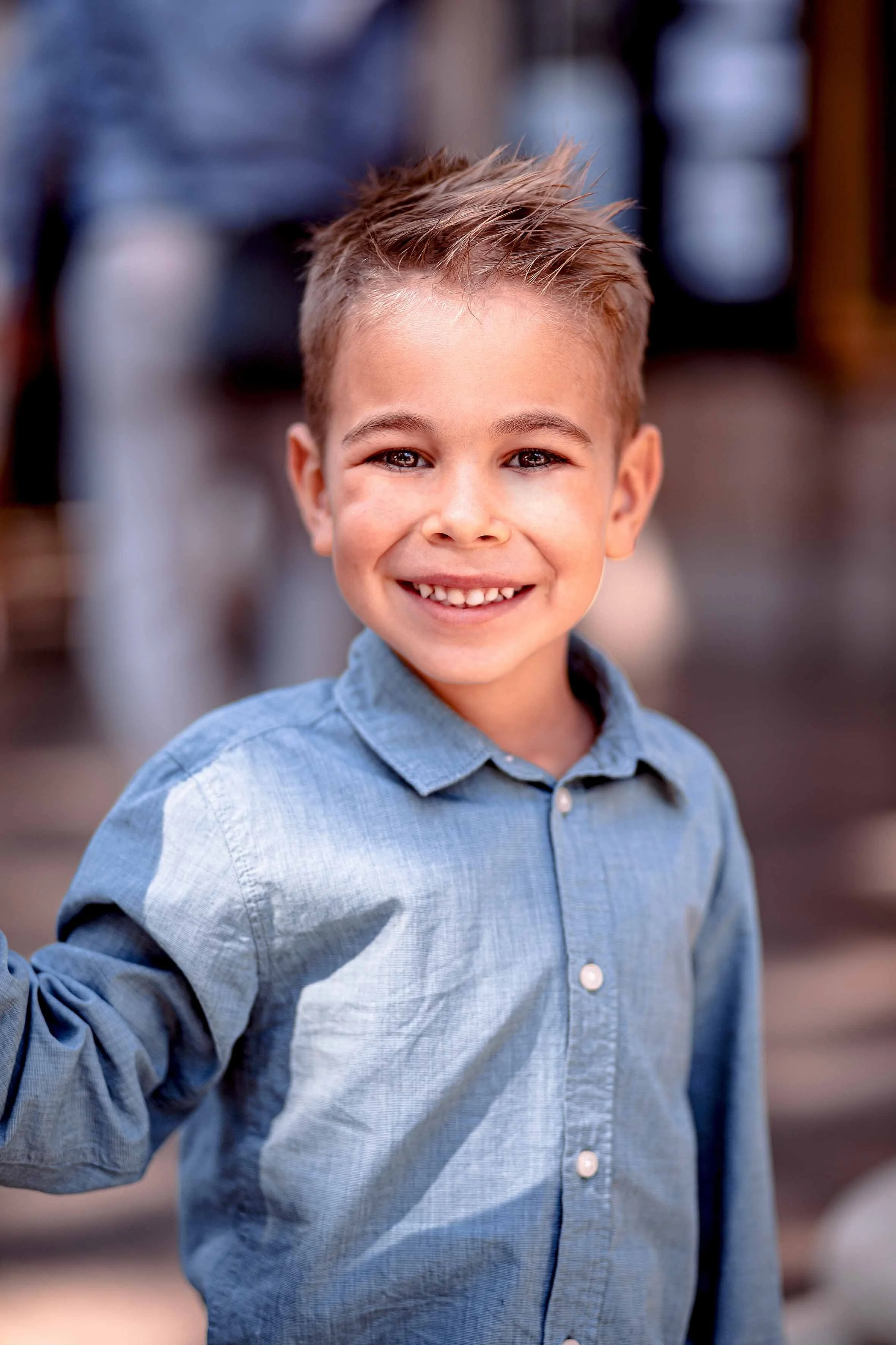 beautiful little boy with blue eyes and blue shirt