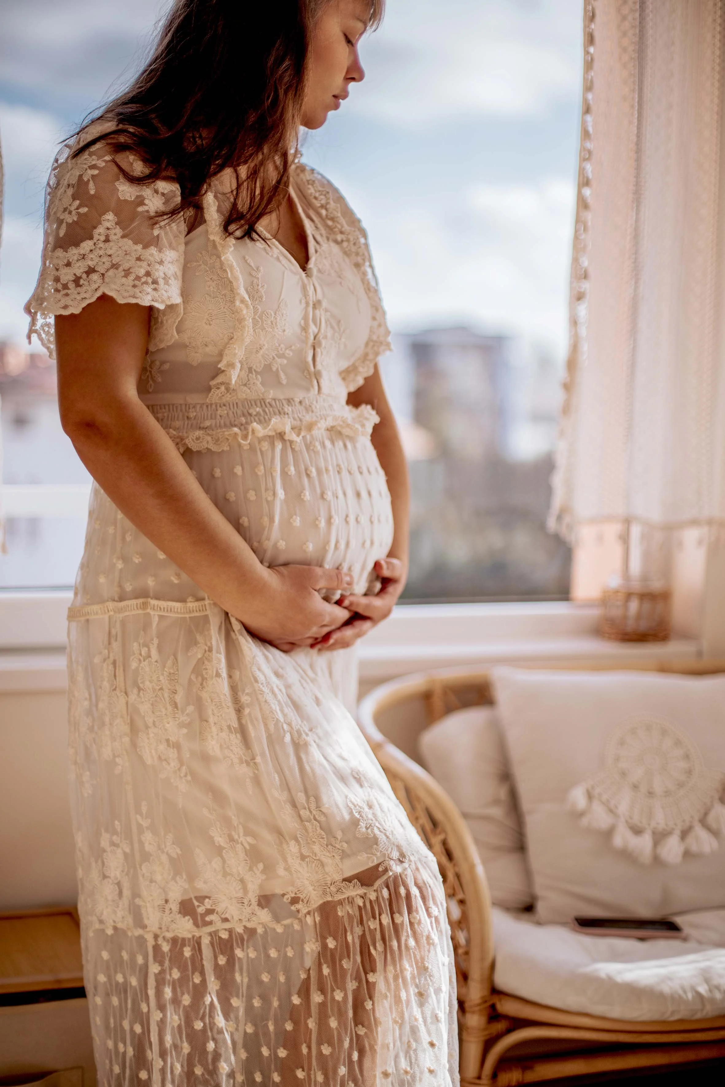 pregnant girl in a lace long dress