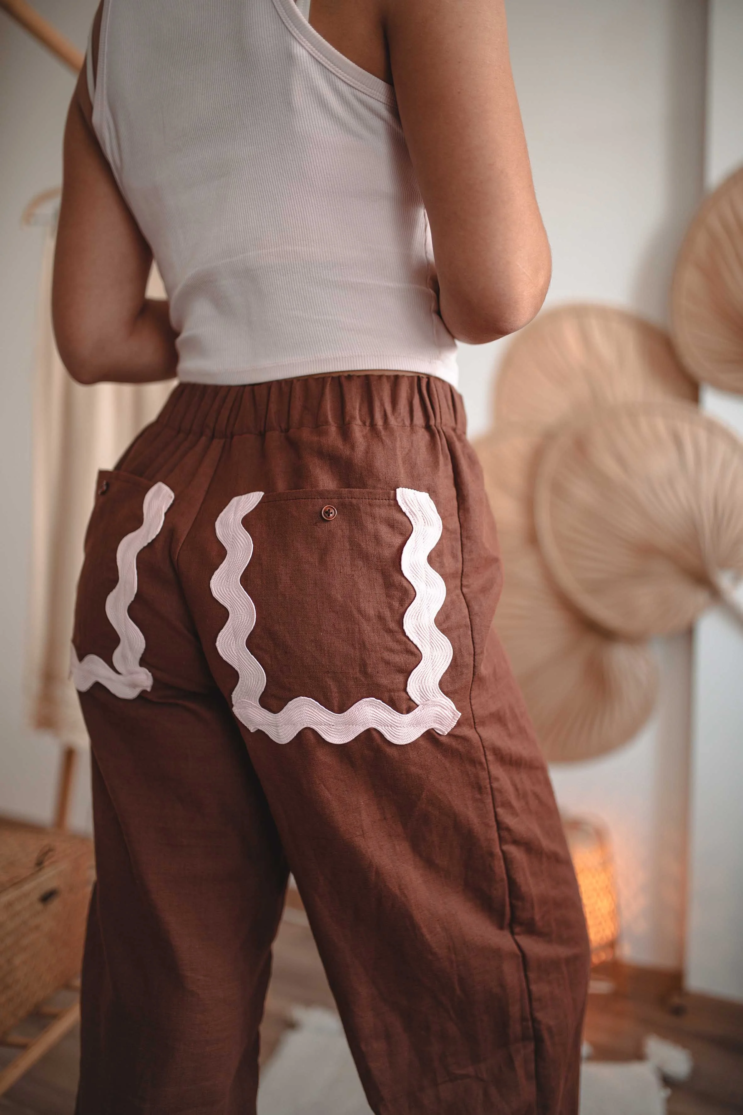fashion photoshoot brown wide pantaloon with ornaments