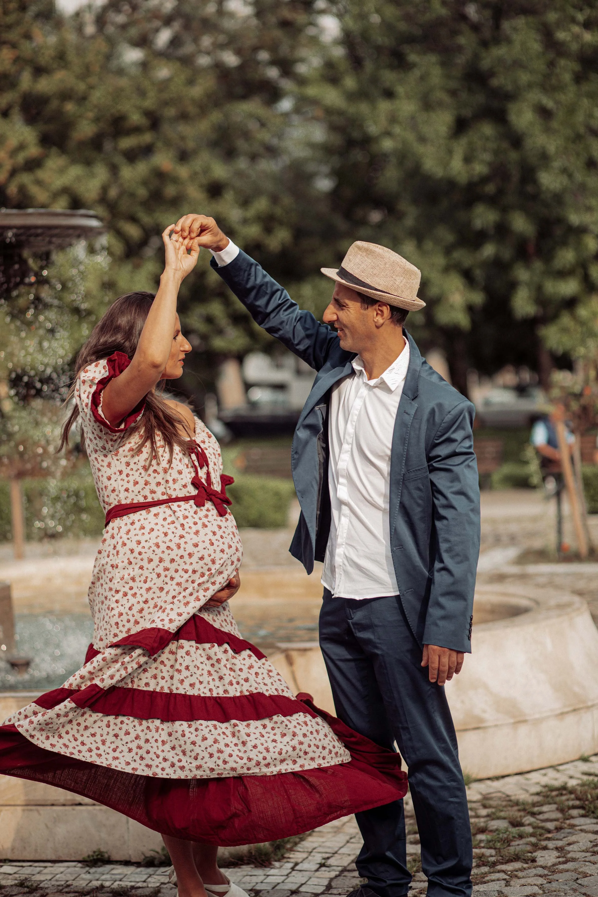 a couple dancing in love expecting their baby