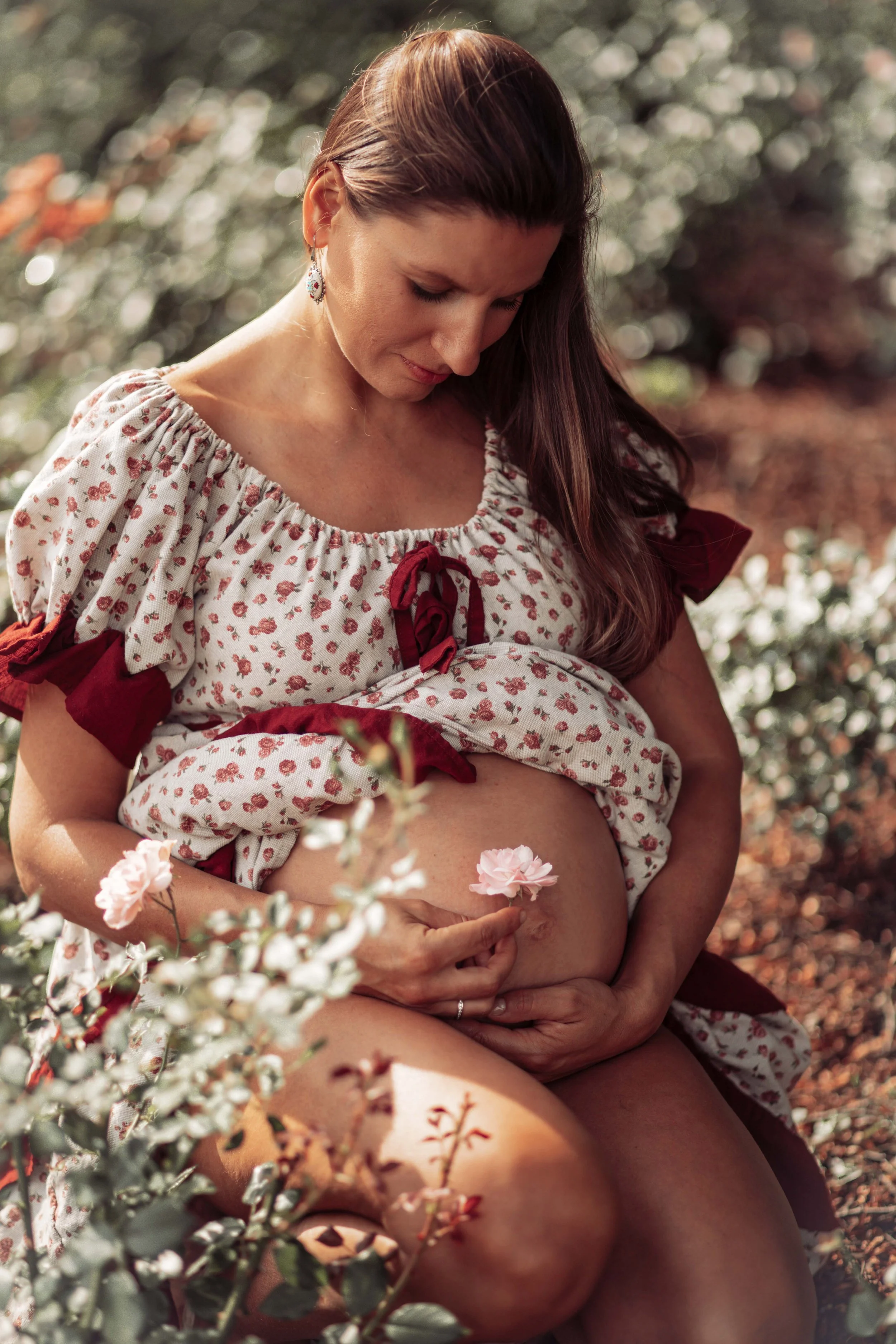 beautiful moment pregnant woman in the garden of flowers