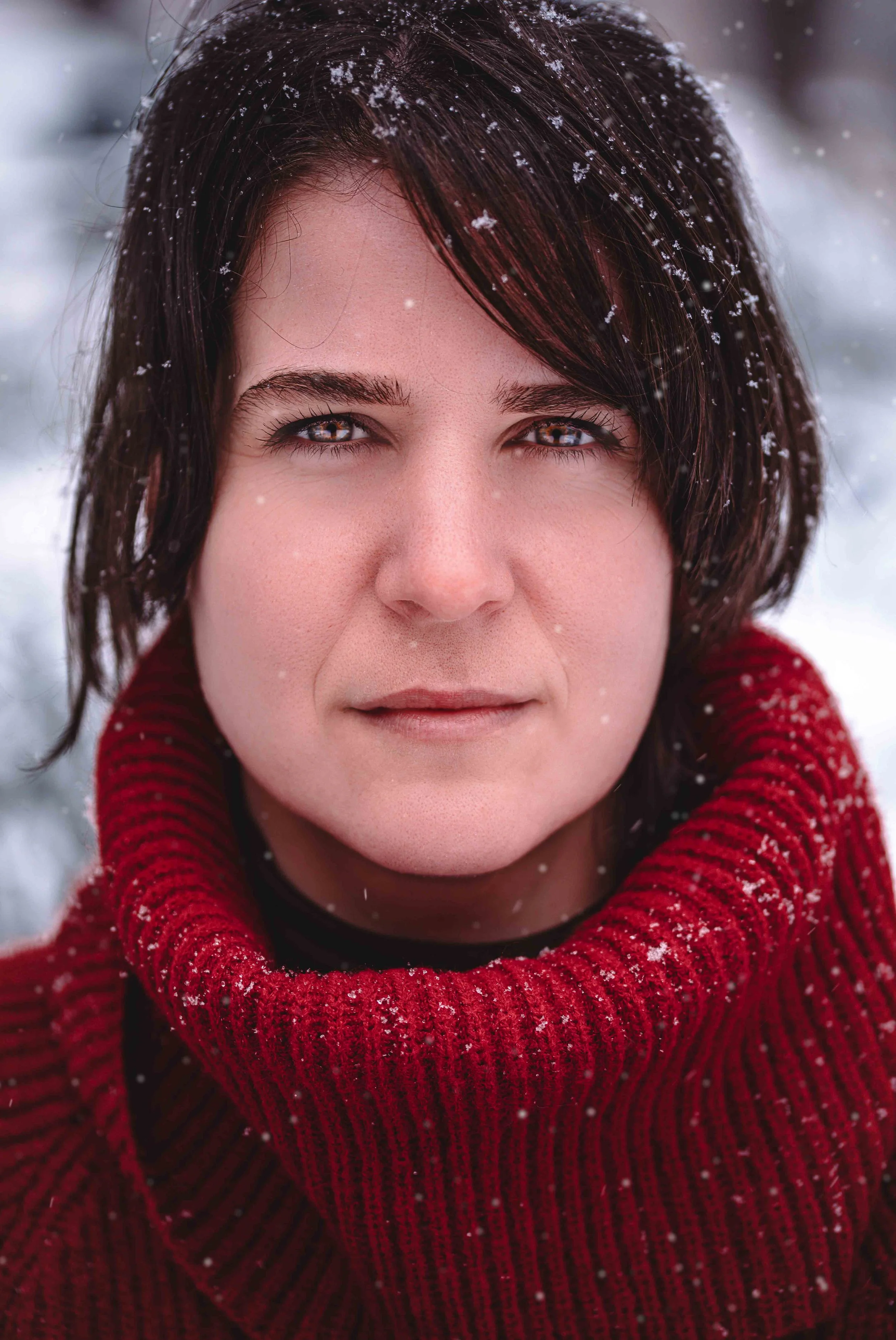 portrait of a woman in red in a French cafe during winter