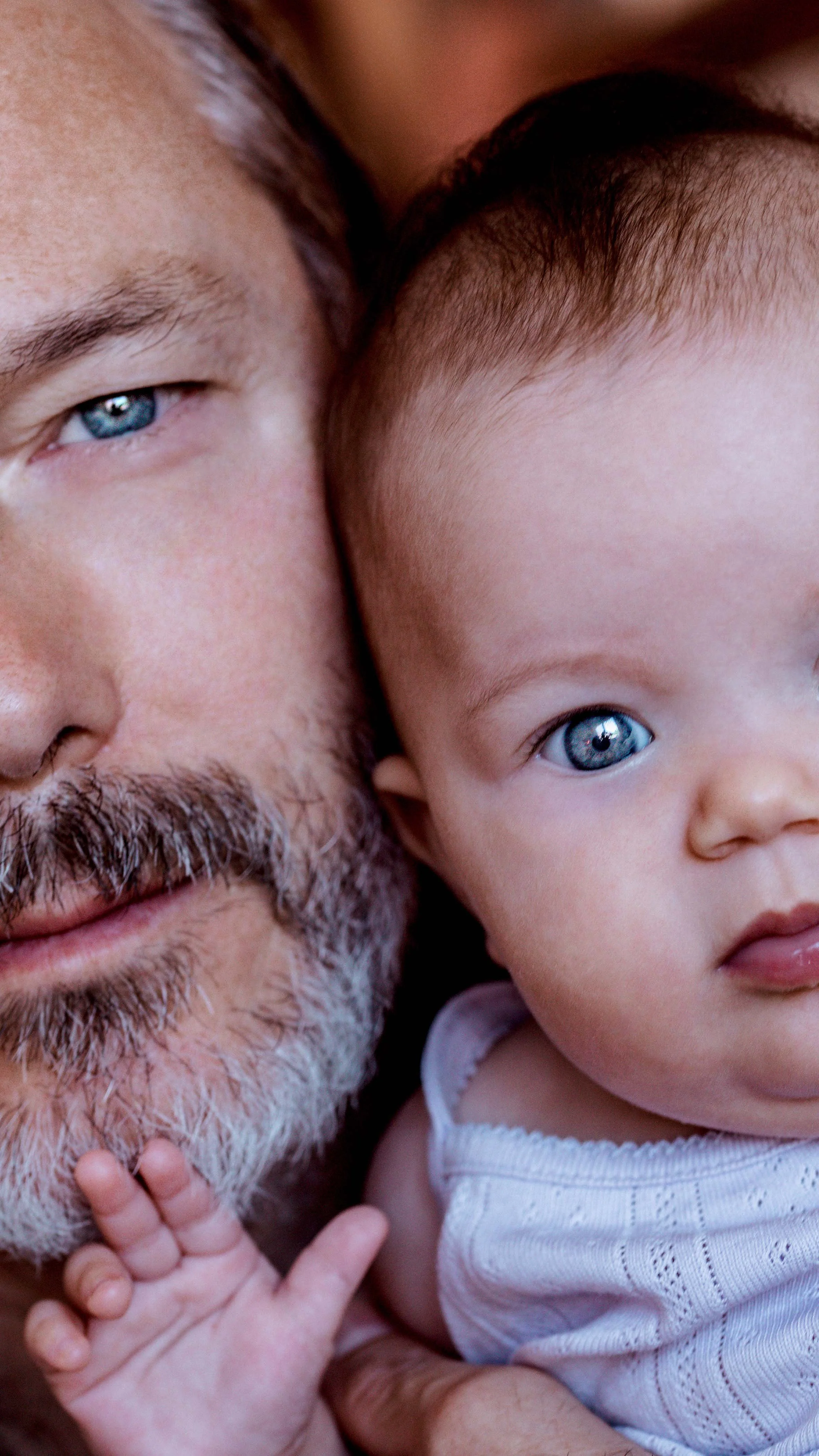 family photoshoot baby with blue eyes portrait father and daughter photo