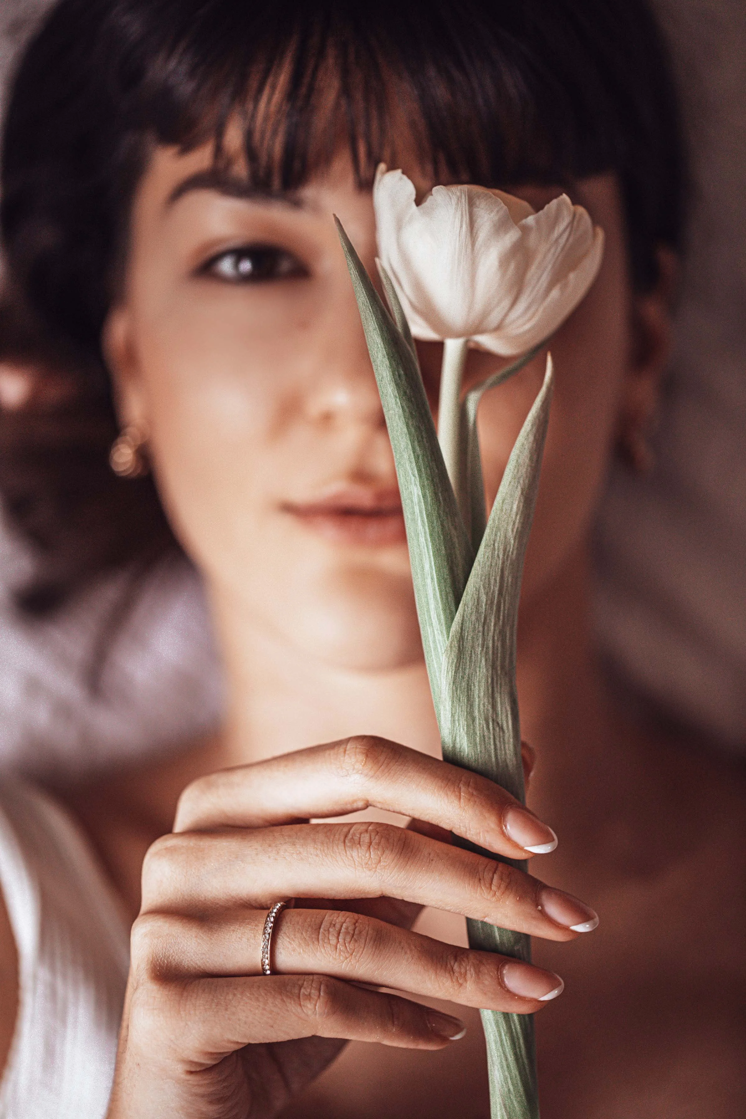 portrait of a beautiful woman with tulip