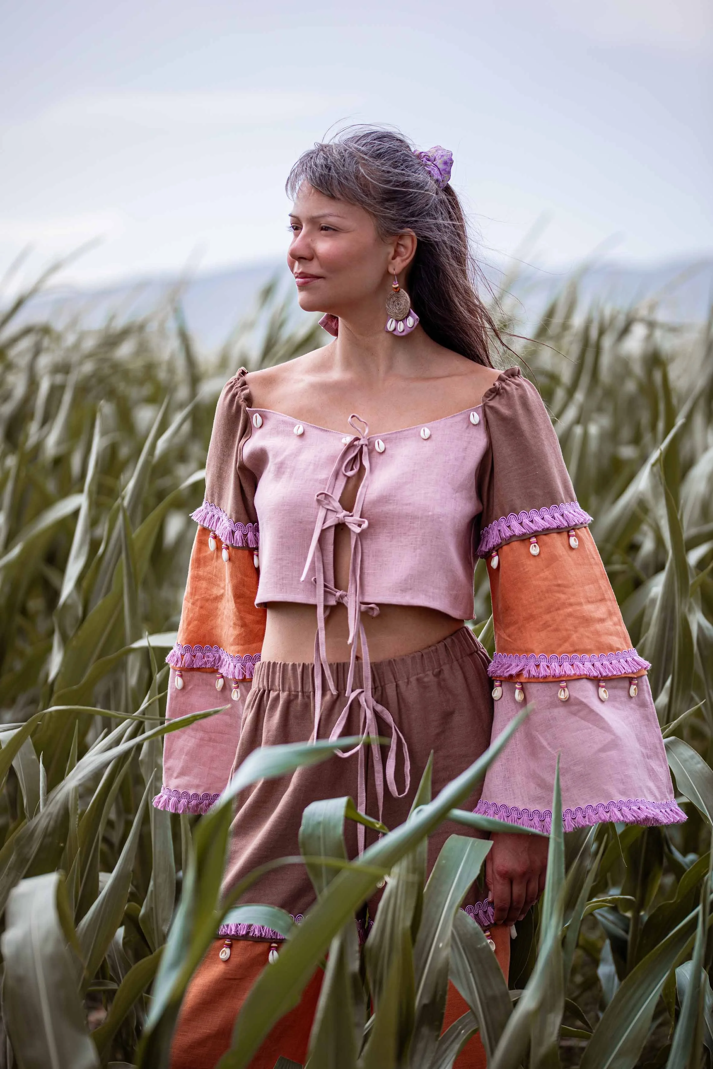 a girl with boho clothes in the field