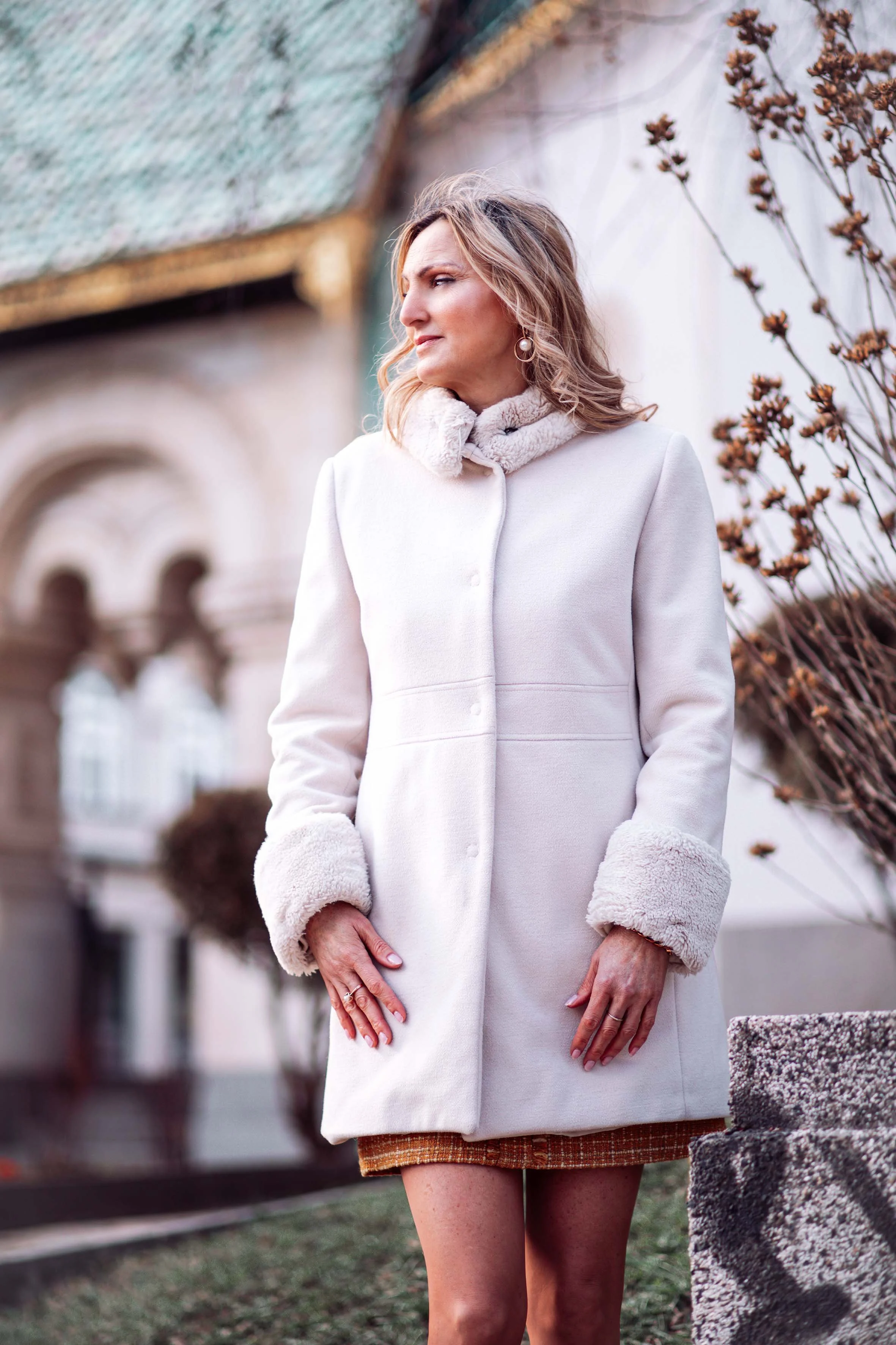 an aristocratic woman in front of the church