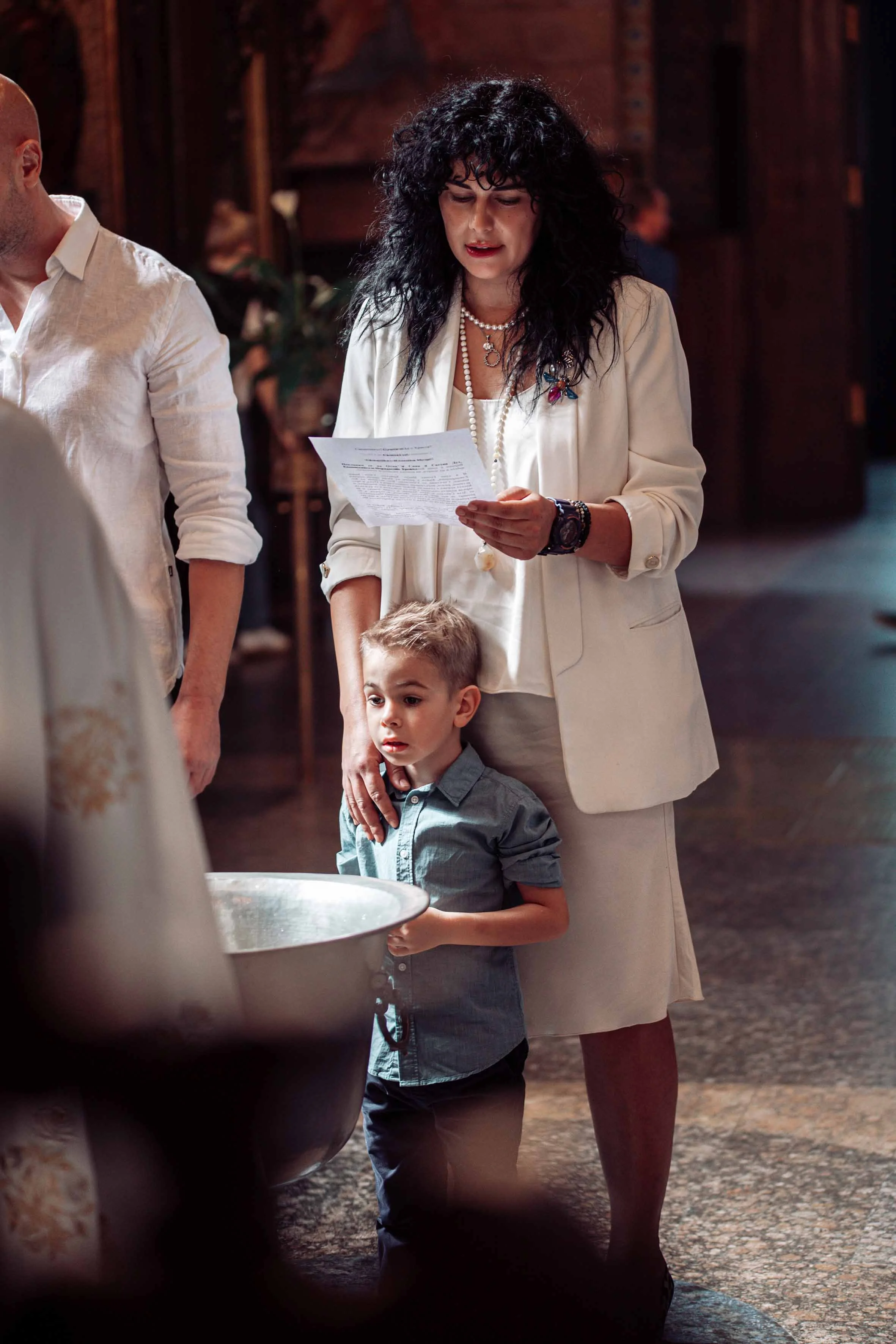 professional photoshoot baptism little boy in the church