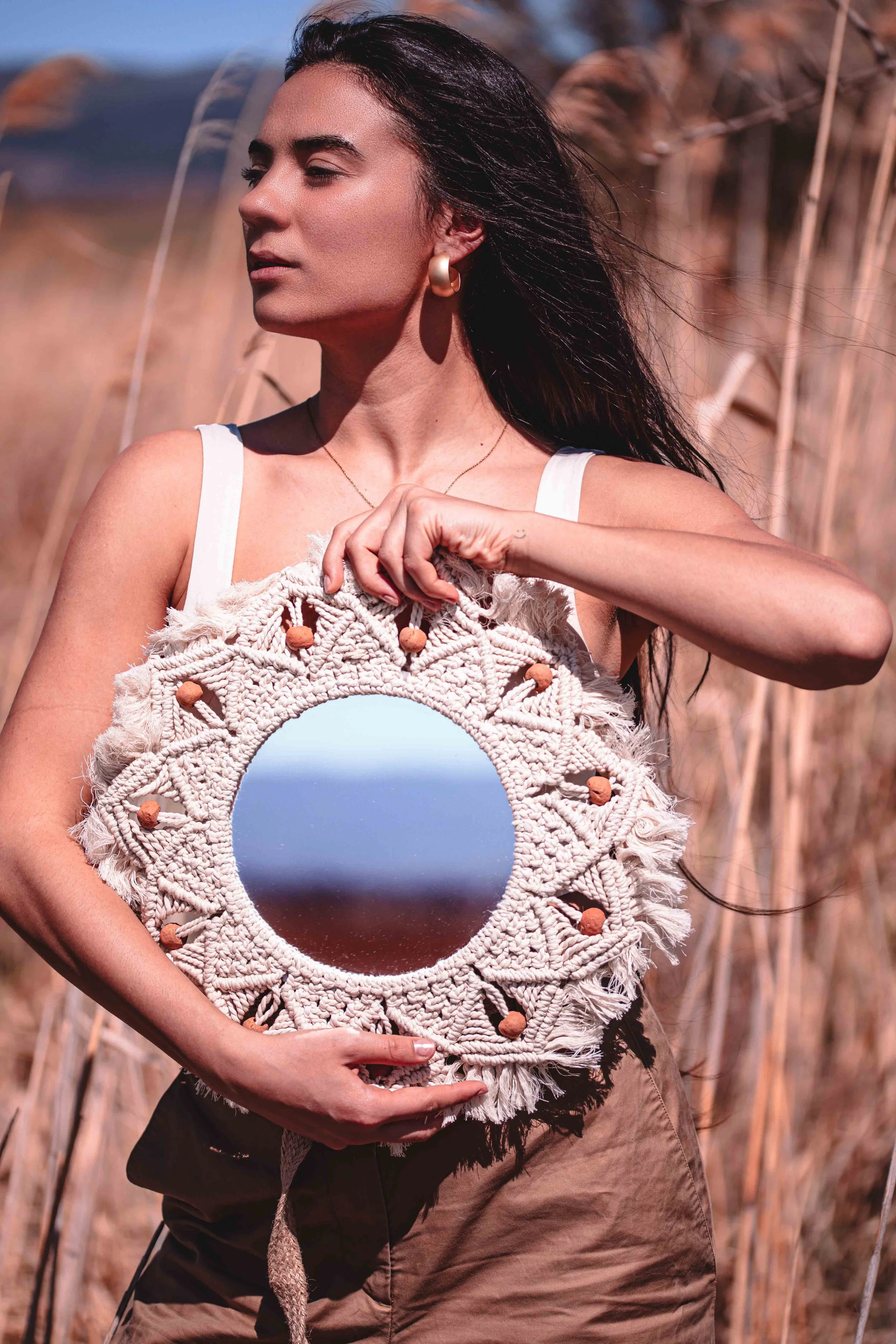 a girl and a boho mirrorr reflection fields of gold