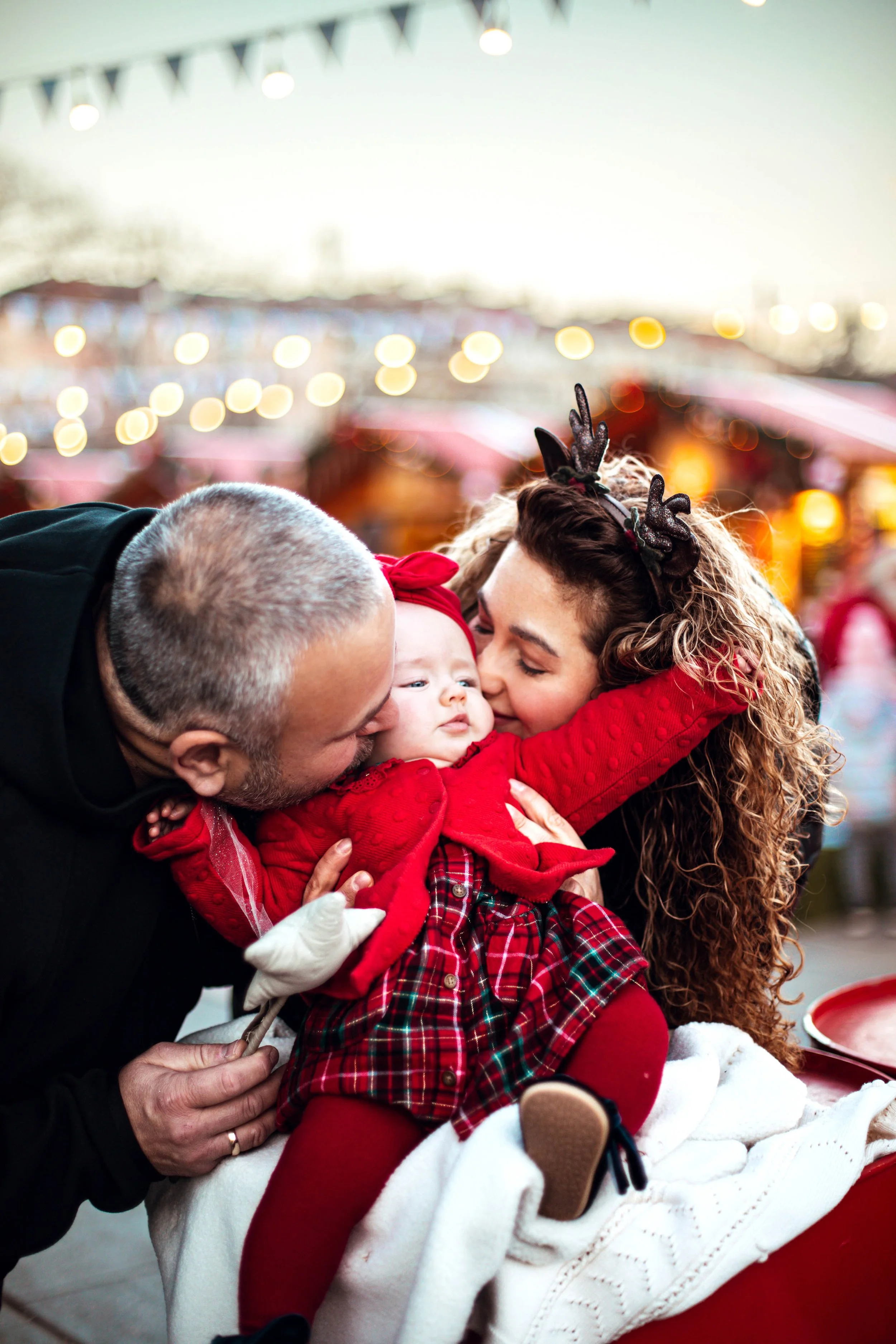 family photo baby professional photoshoot beautiful baby with blue eyes dressed in red