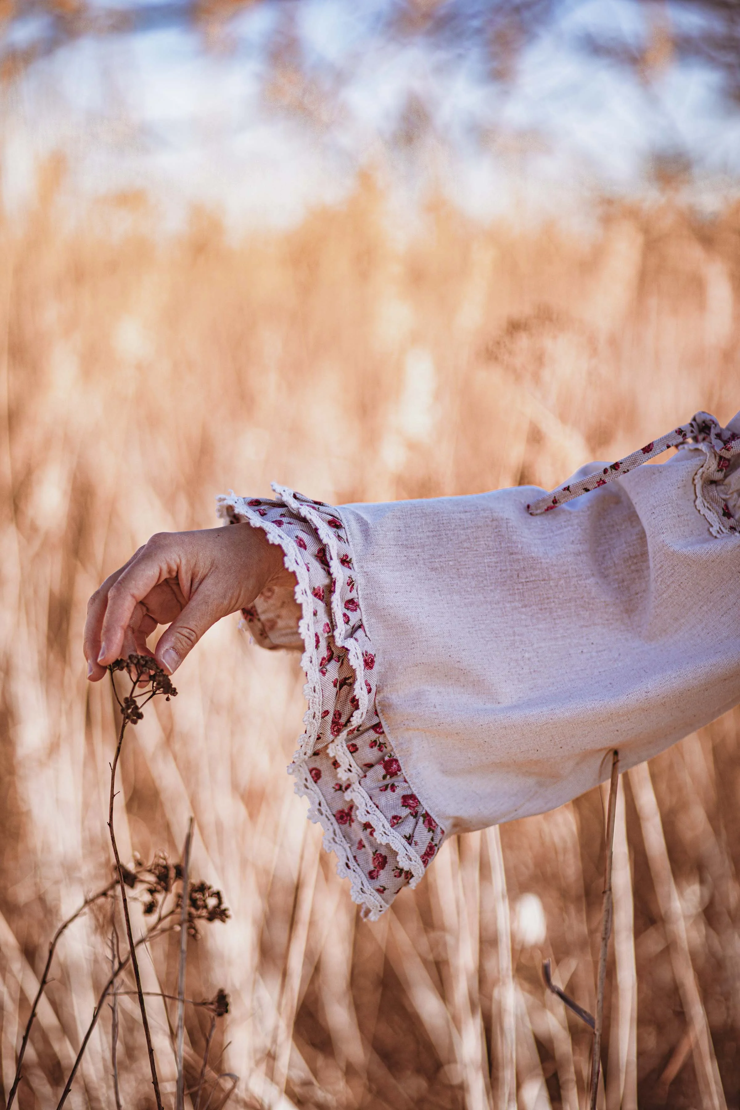details photography a hand touching a flower 