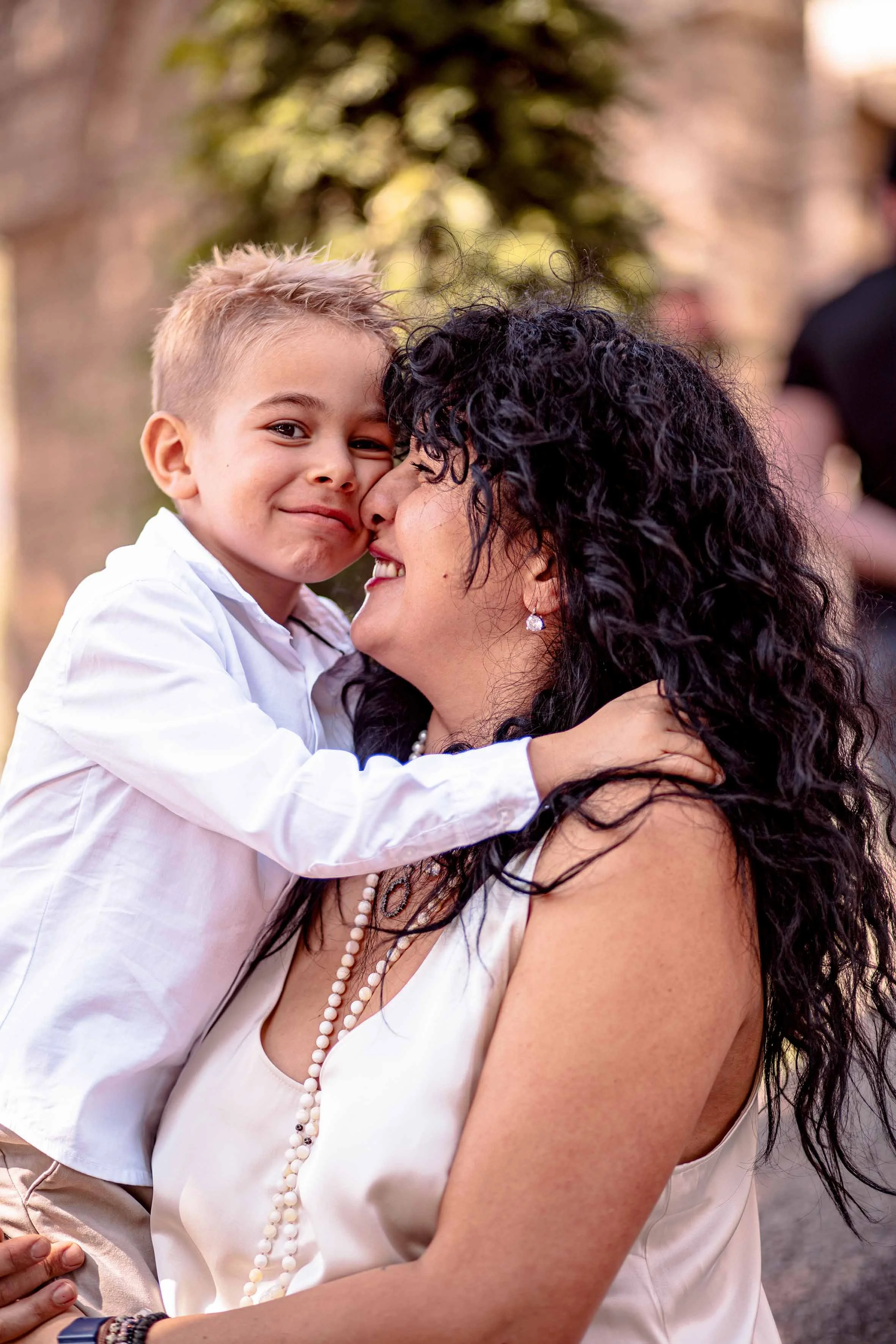 professional photoshoot baptism little boy with his aunt