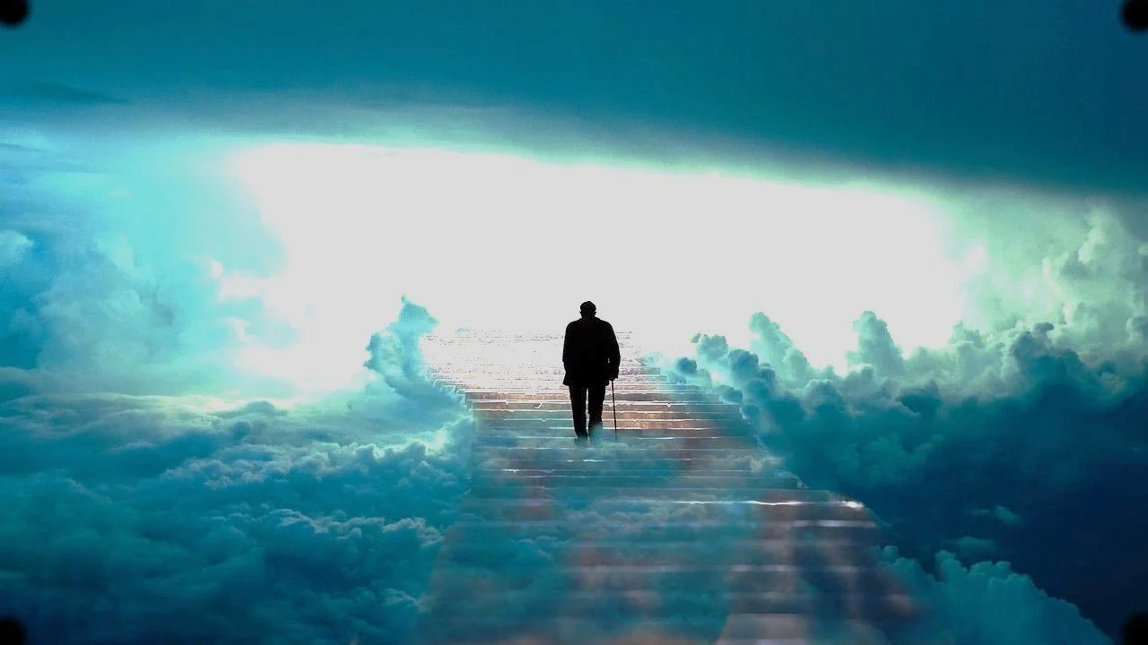 A person walking up a staircase made of clouds towards a bright, heavenly light in the sky.
