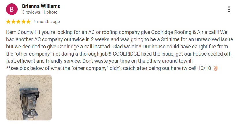 Photo of an outdoor electrical panel or circuit box lying on the ground against a concrete surface.