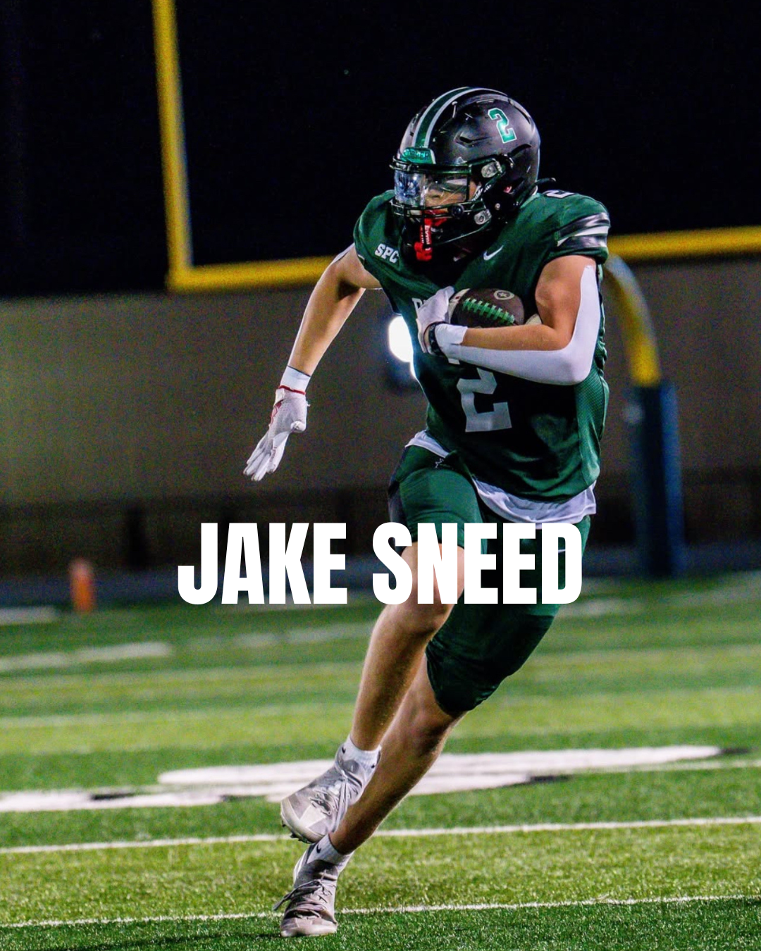 A football player in a green uniform with the number 2 running on the field holding a football. The player is wearing a black helmet, white gloves, and white cleats, with a yellow yard line visible on the field in the background. Text overlay reads 'JAKE SNEED'.