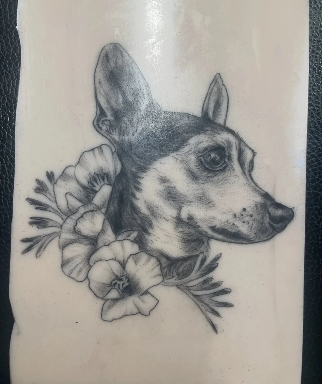 Realistic highly detailed tattoo pet portrait of a dog flowers tattoo Santa Cruz female tattoo artist fine line