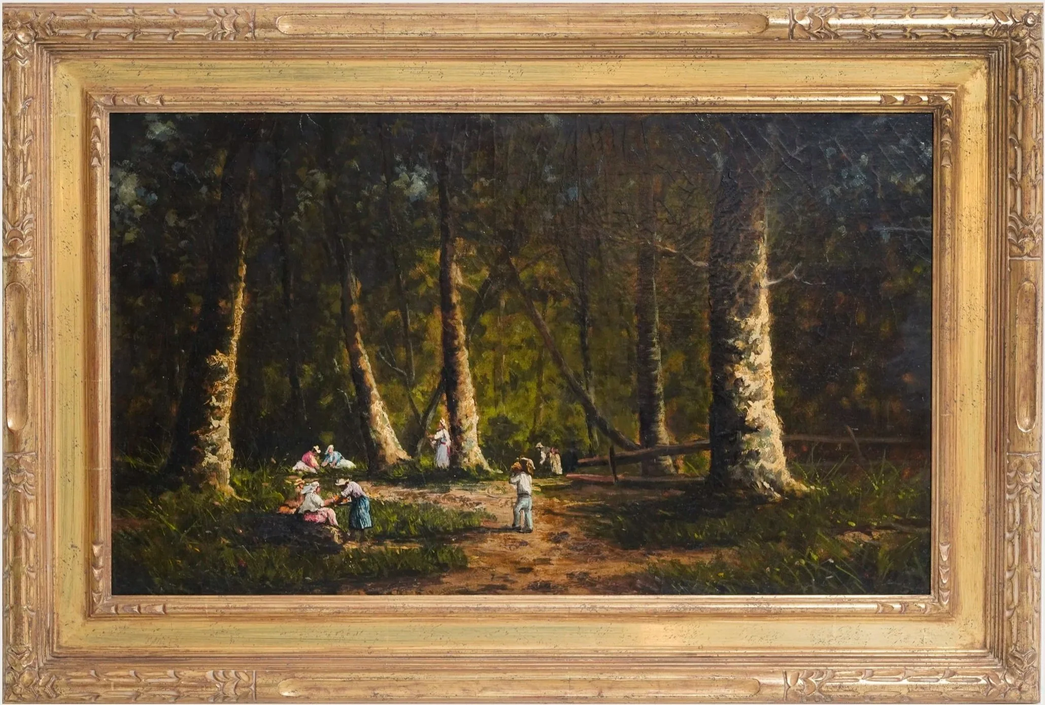 A painting of a wooded landscape with tall trees and a group of children playing on the grass, framed in an ornate gold frame.