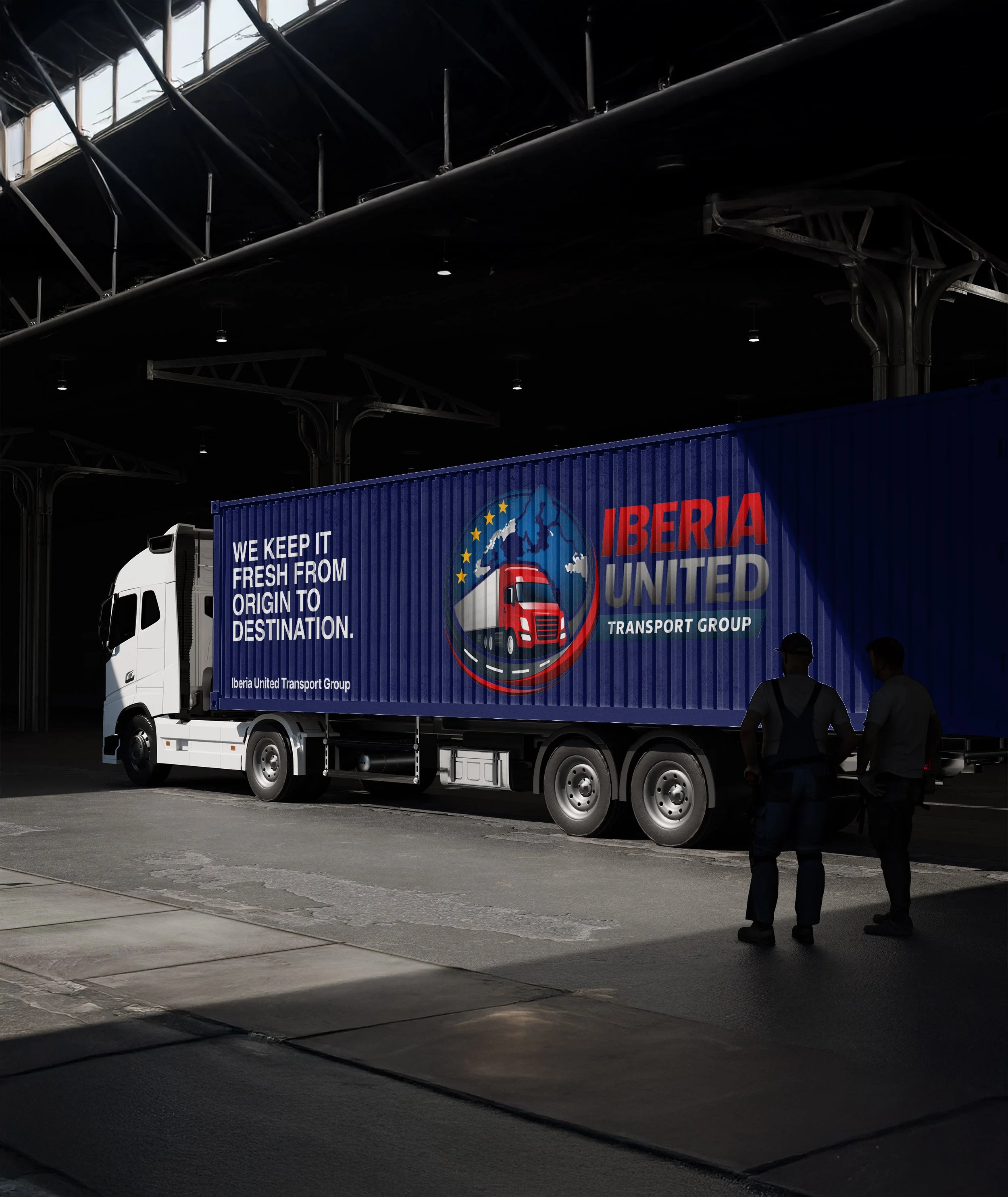 A large semi-truck with a blue trailer bearing the Iberia United Transport Group logo and slogan, parked inside a warehouse or loading dock, with two people standing nearby in conversation.