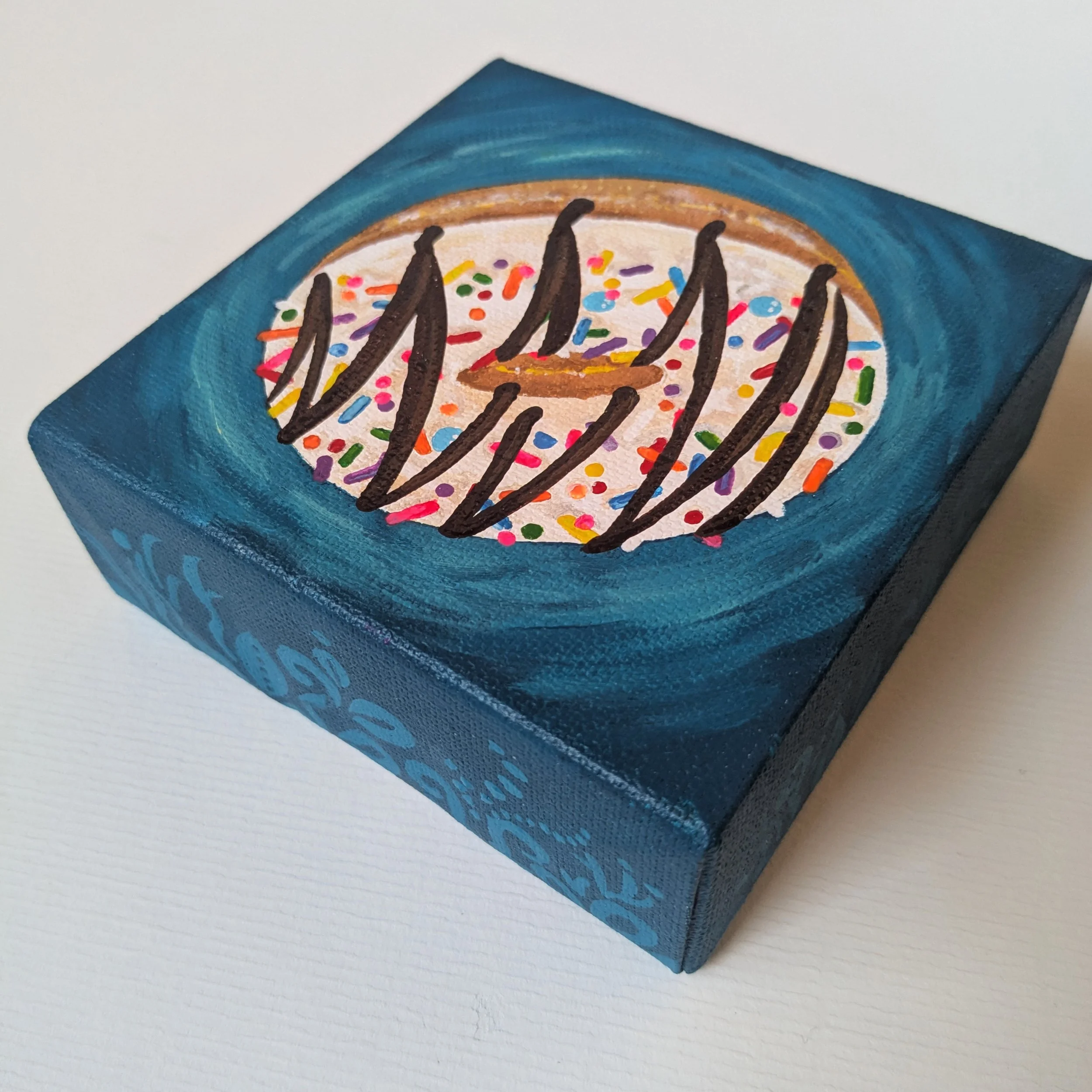 4x4-Donut-rainbowsprinkleschocodrizzleonteal-top.jpg