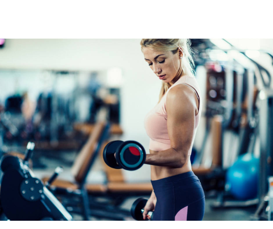 Girl working out in gym with weights