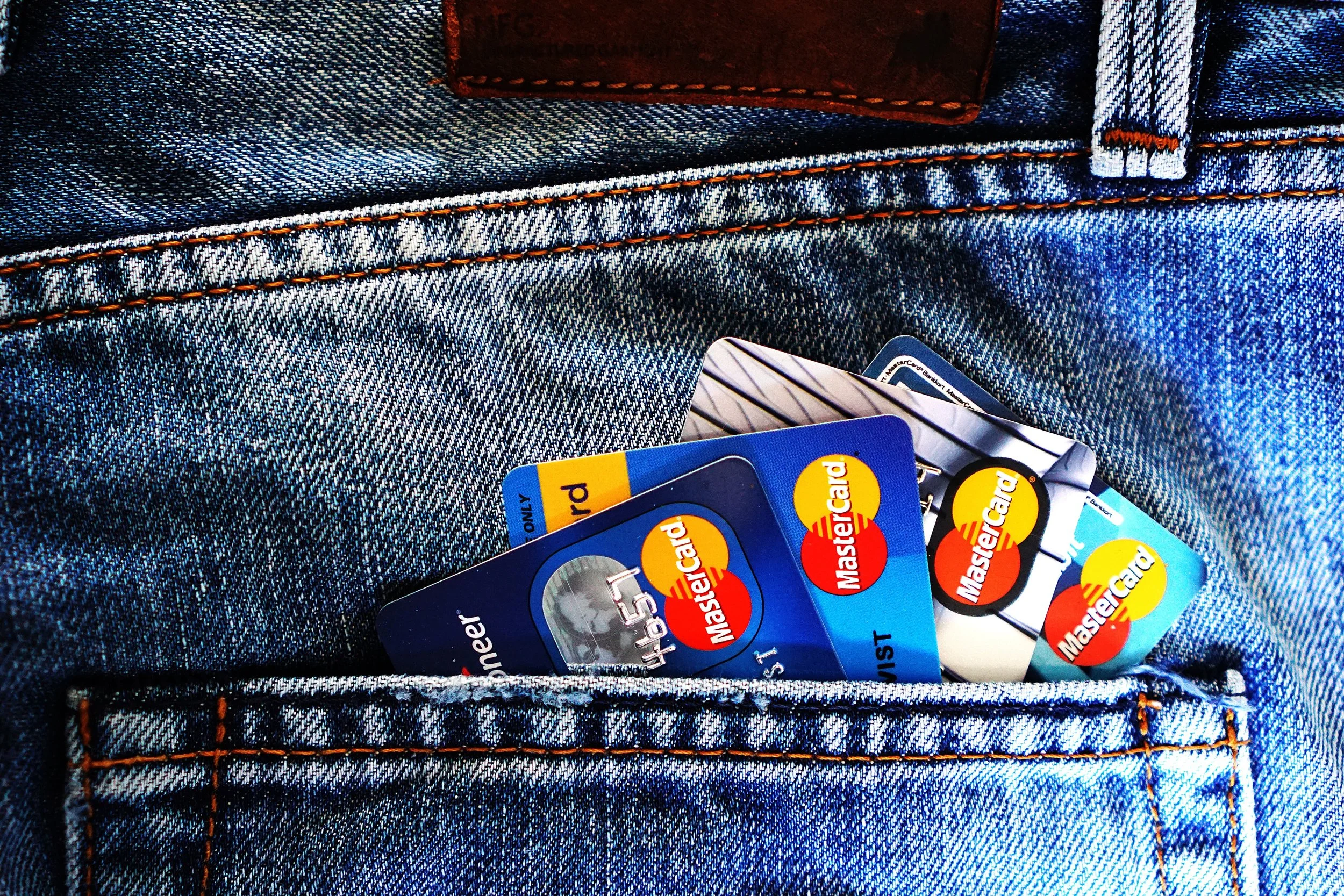 Many credit cards in back jeans pocket
