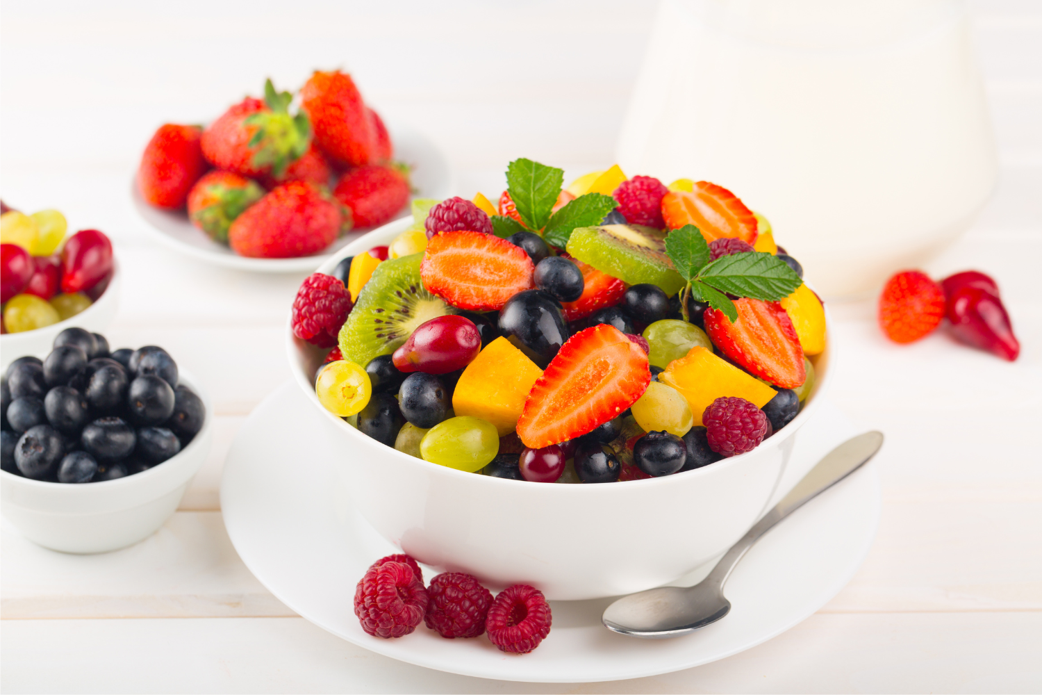 Sale on fruit:  strawberries, blueberries, grapes, peaches