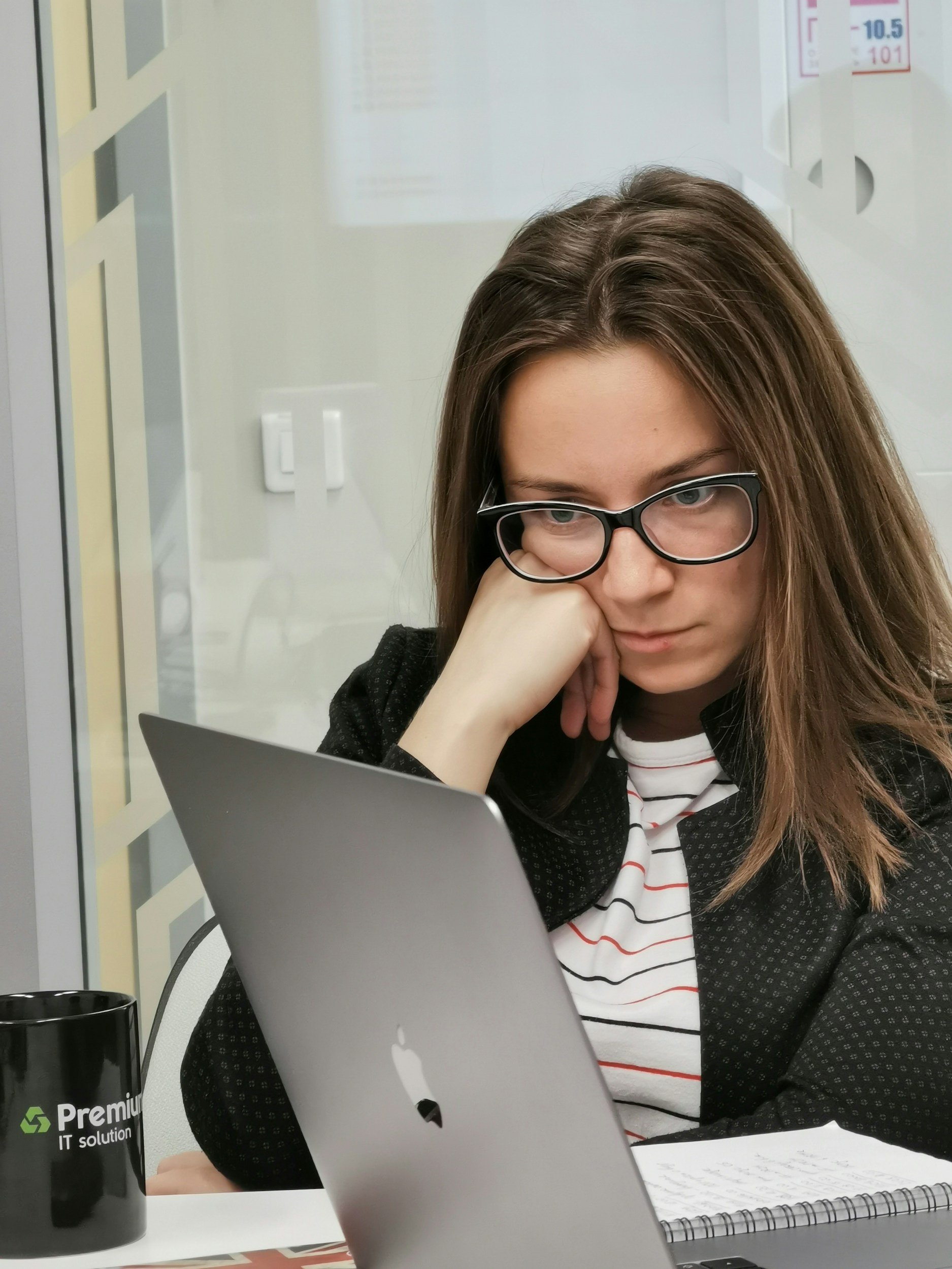 woman looking at computer looking stress over money