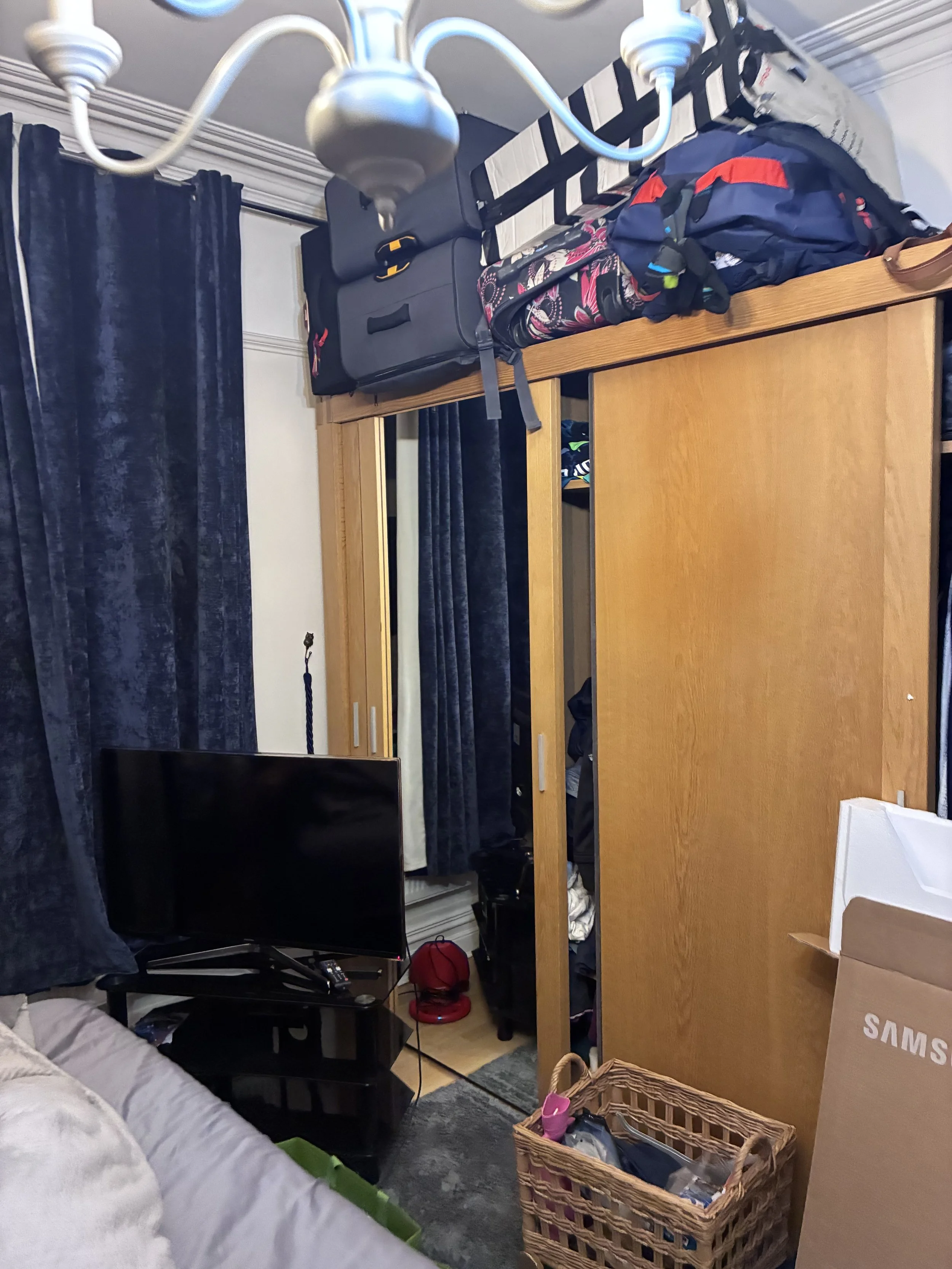 Before and after closet storage optimization by an organising business. Allsop's All Sorted transformed a messy bedroom wardrobe into a structured, tidy layout in Frome