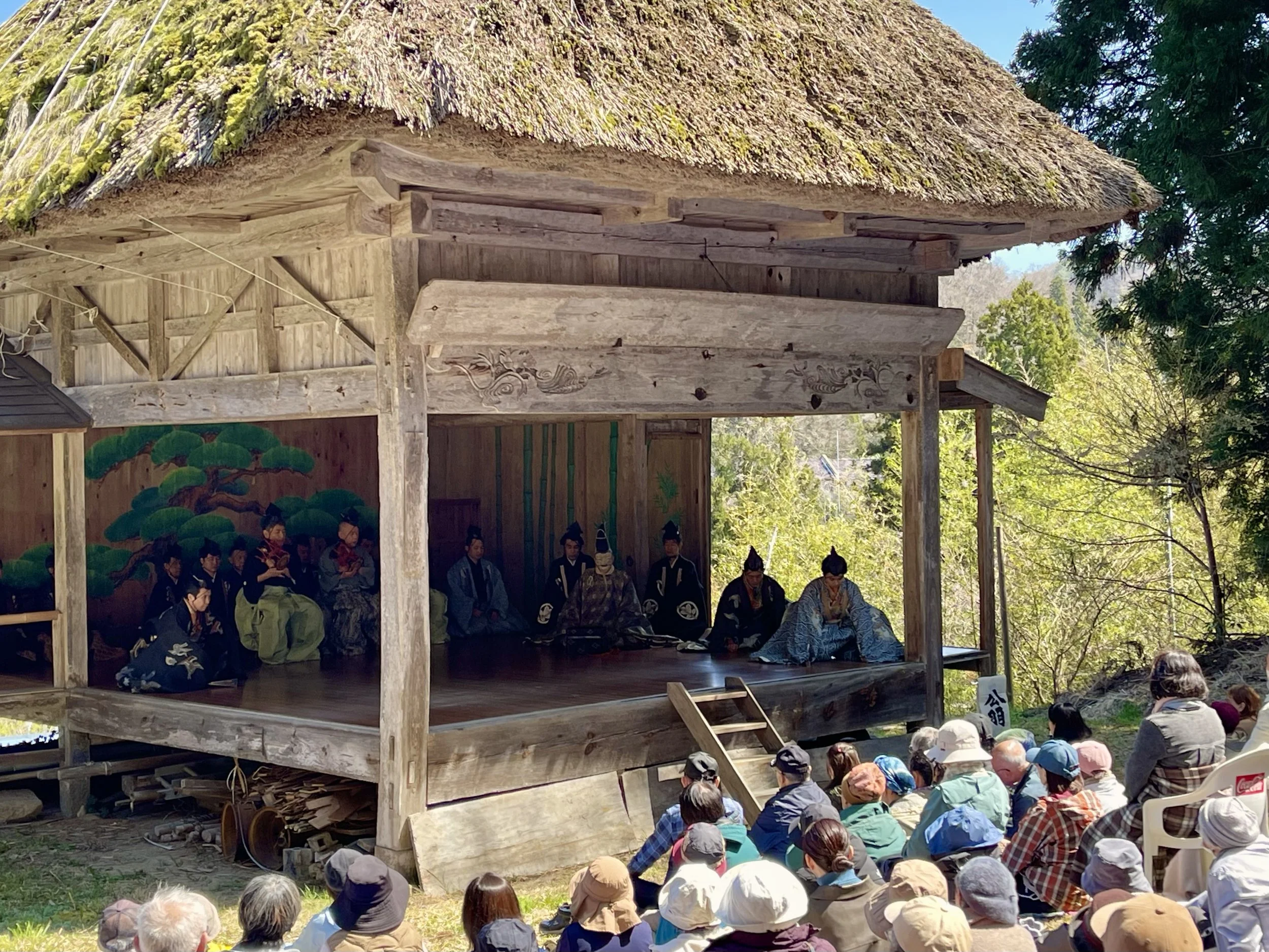 Modern audience watching a Noh performance at Kodomari Hakusan Shrine on Sado Island