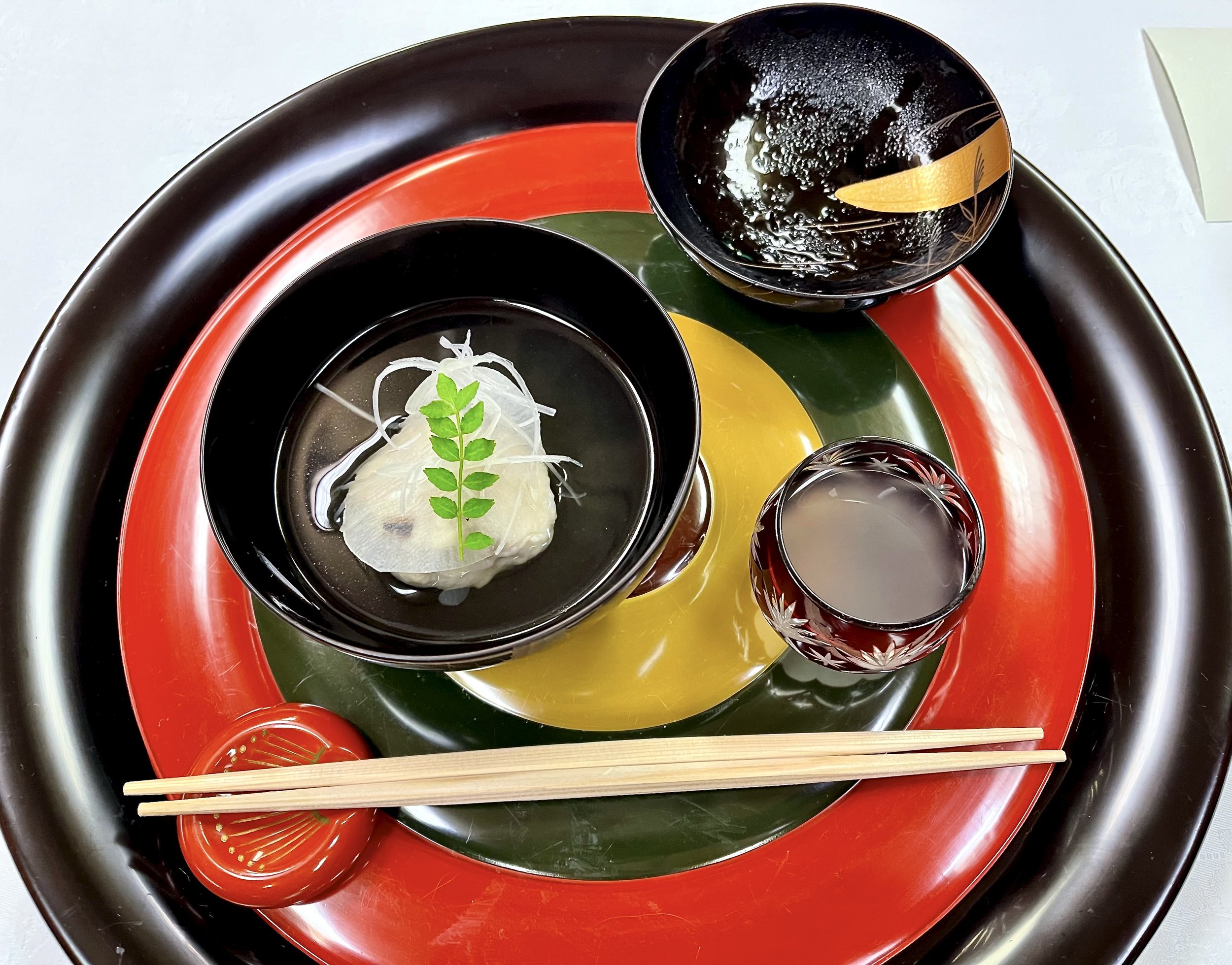 Seasonal Kaga cuisine served on a black, red, and yellow lacquer tray at Kocho in Yamanaka Onsen