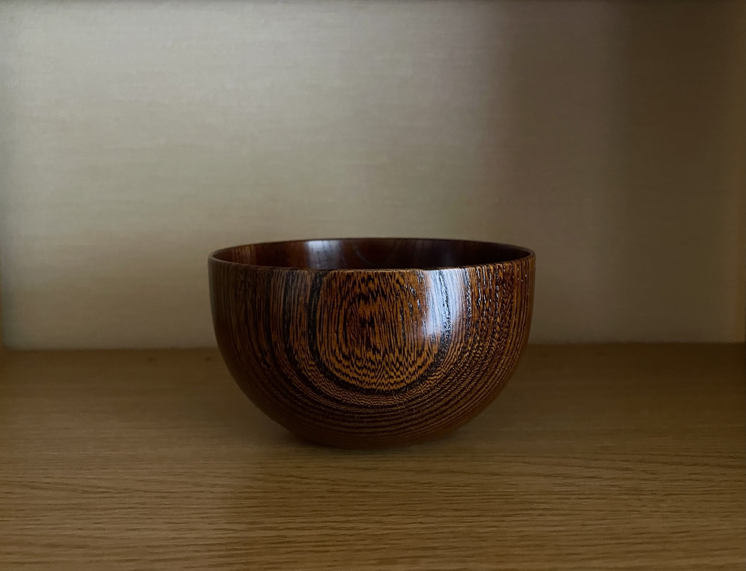 Yamanaka-shikki lacquer bowl in zelkova wood with translucent amber finish, handmade in Yamanaka Onsen.
