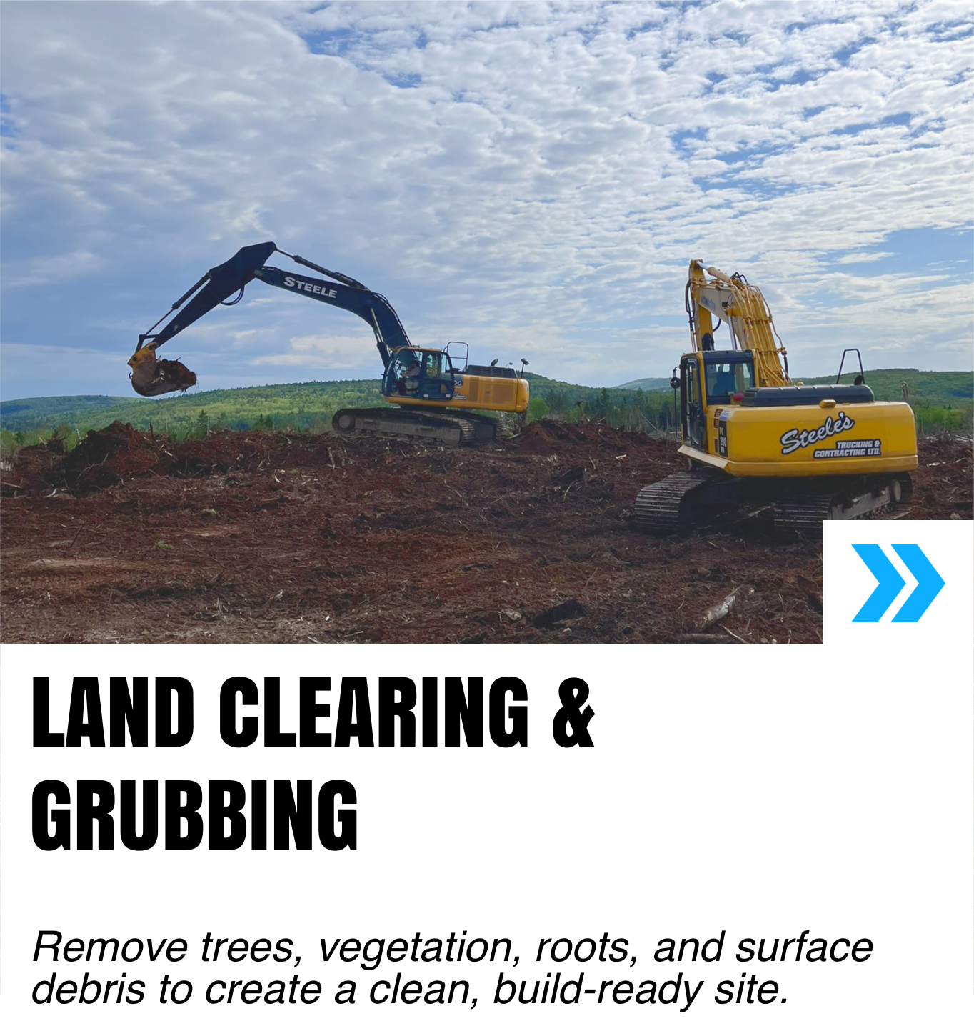 Two yellow excavators working on land clearing, one digging and the other on the site, under a partly cloudy sky with green hills in the background.