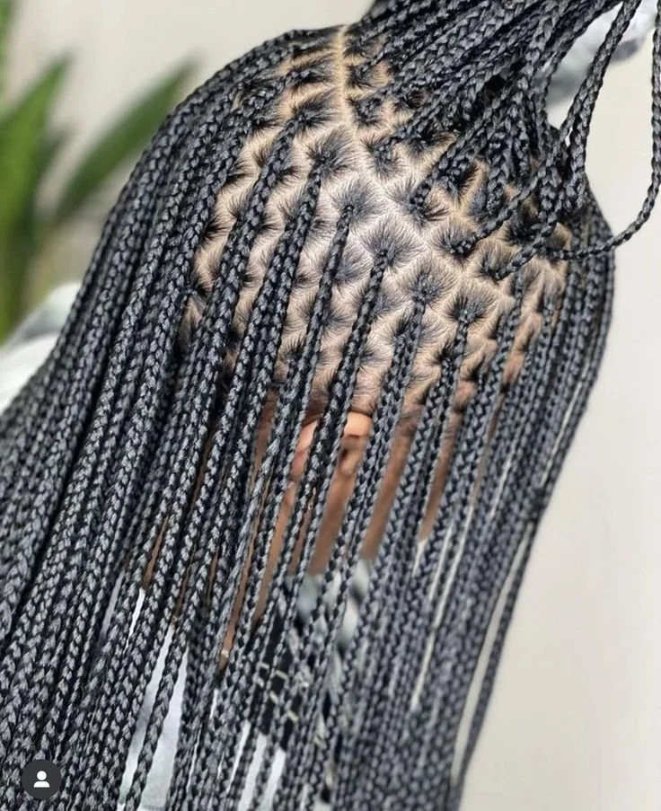 The Minimalist Knotless Silhouette 
Name: The Artisan Knotless

Description: "Our masterclass in precision. By utilizing a knotless technique, we prioritize scalp health and a natural fall from the root. This silhouette is defined by its clean partin