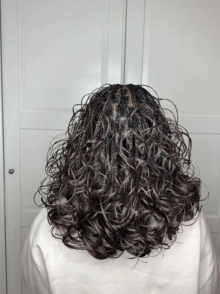 The French Curl Collection 
Name: The Parisian Spiral

Description: "Inspired by sophistication, this silhouette features sleek, precise braiding that transitions into generous, romantic spirals. The dramatic volume at the ends provides a soft, femin