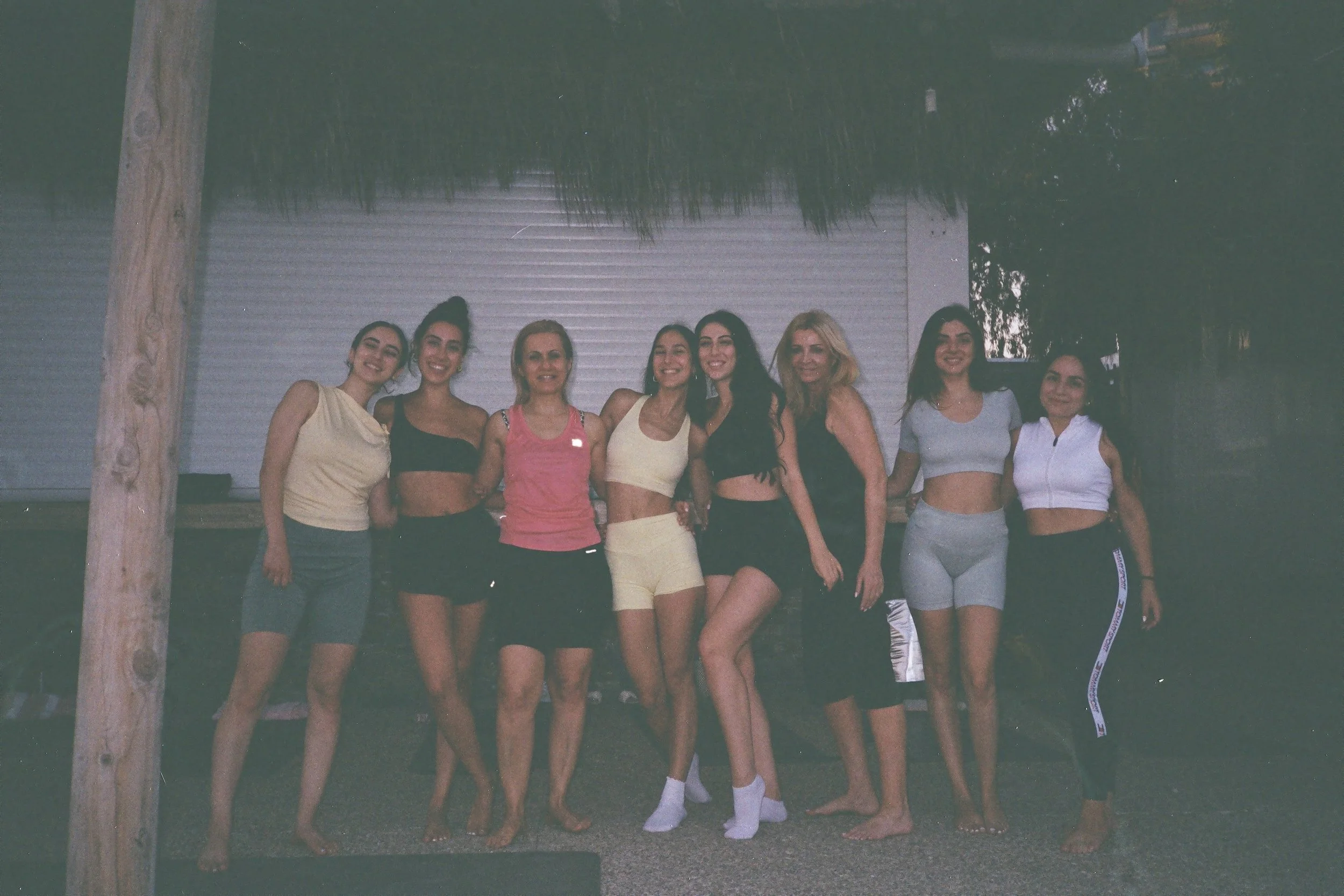 Group of 9 happy women after a yoga therapy session with Angelica