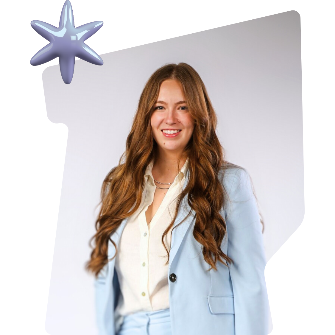 A young woman with long wavy brown hair smiling, wearing a light blue blazer over a cream blouse, against a plain white background with a decorative star shape in the upper left corner.