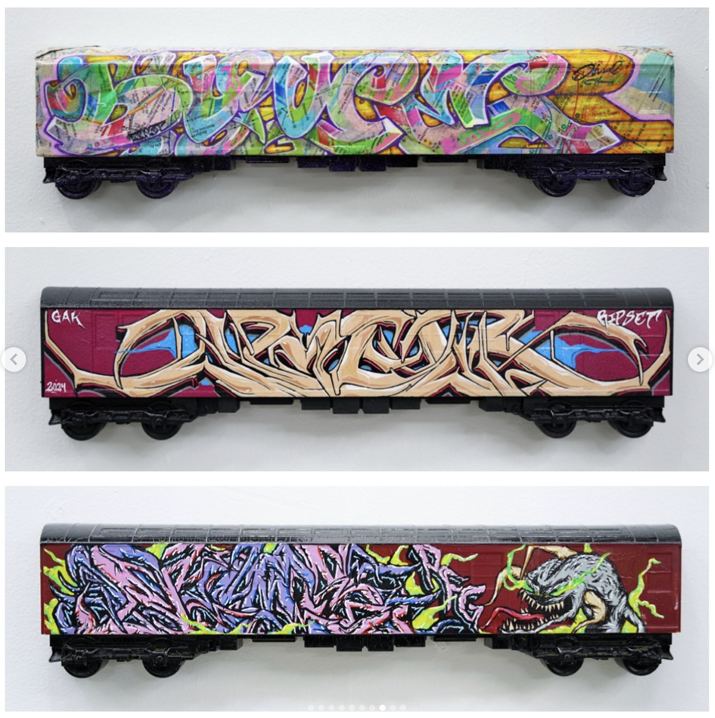 Three train cars decorated with colorful graffiti art, each with distinct styles and vibrant colors.