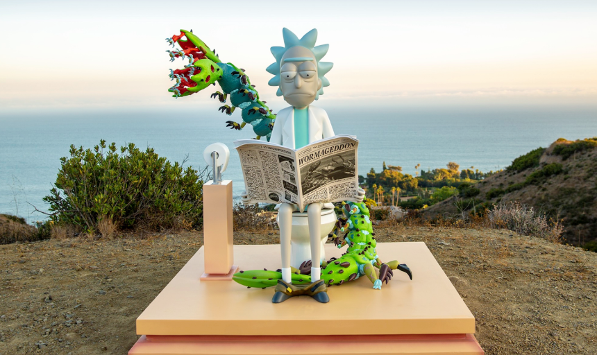 A toy scene with a zombie Rick Sanchez figure from "Rick and Morty" sitting on a pink block, reading a newspaper titled "WORRAGEDDOM," with multiple cartoonish green and red monsters arranging around it, against a backdrop of coastal hills and ocean at sunset.
