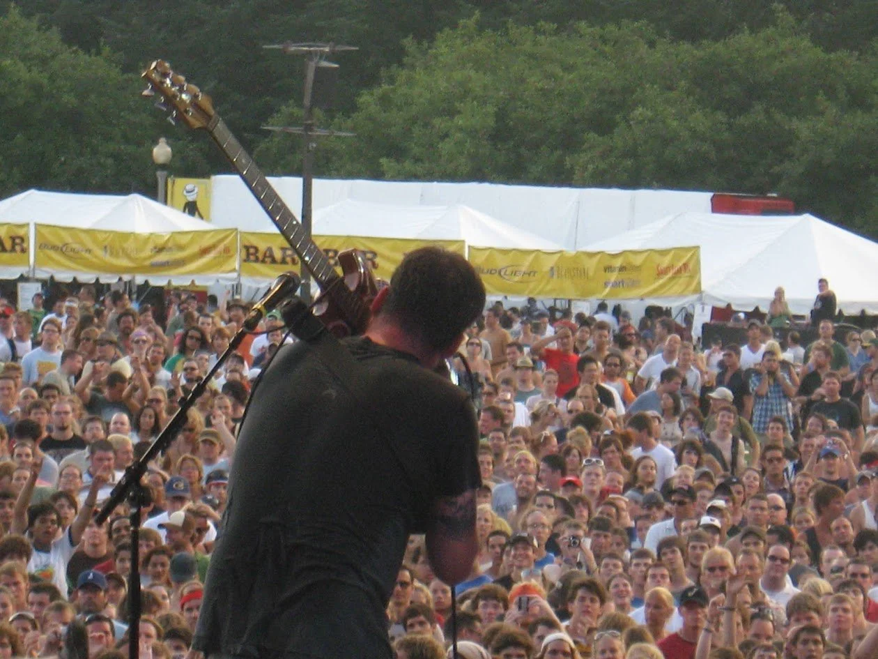 Modest Mouse plays guitar with teeth. Lollapalooza. Chicago. Grant Park.
