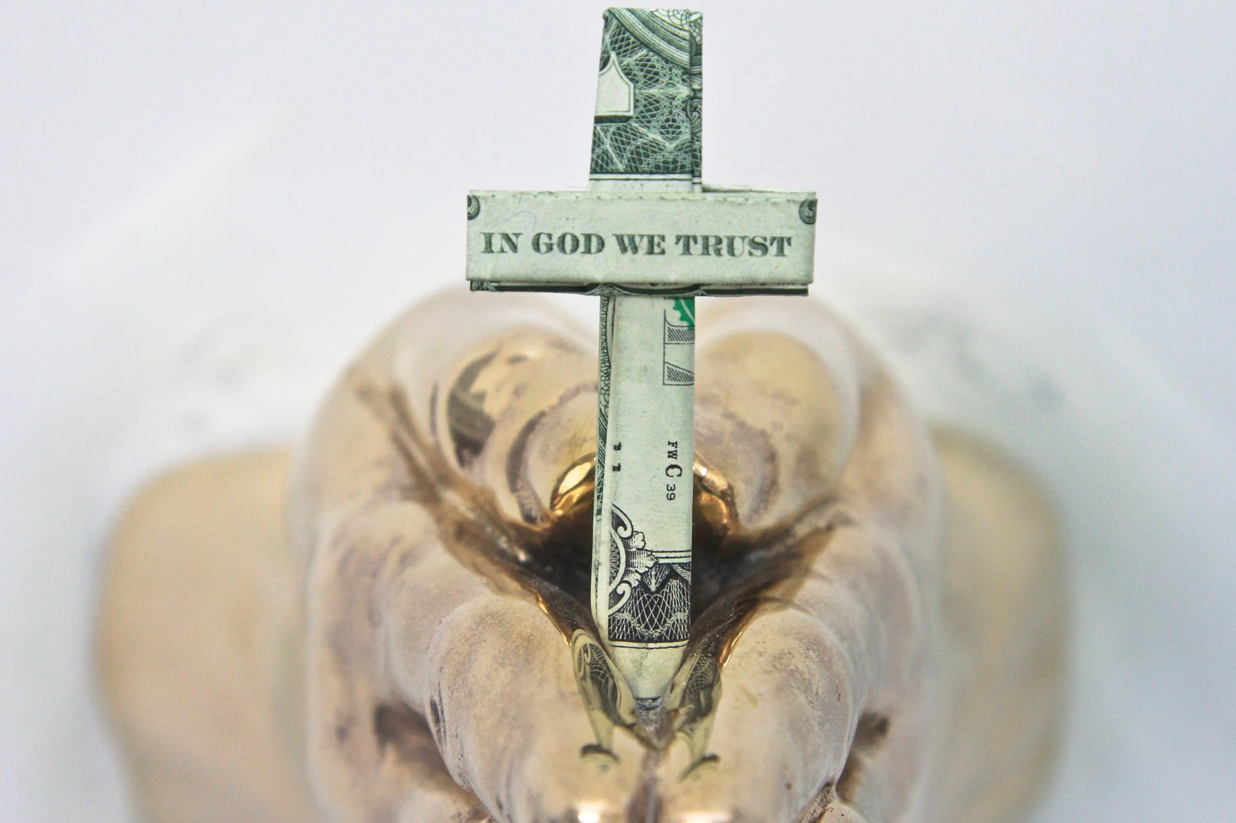 IN GOD WE TRUST EVERYONE ELSE
PAYS CASH - CROSS (front view), 2015, Bronze and Dollar Bills, 6 (slight variation) x 8 x 5 inches (15.2 x 20.3 x 12.7 cm)