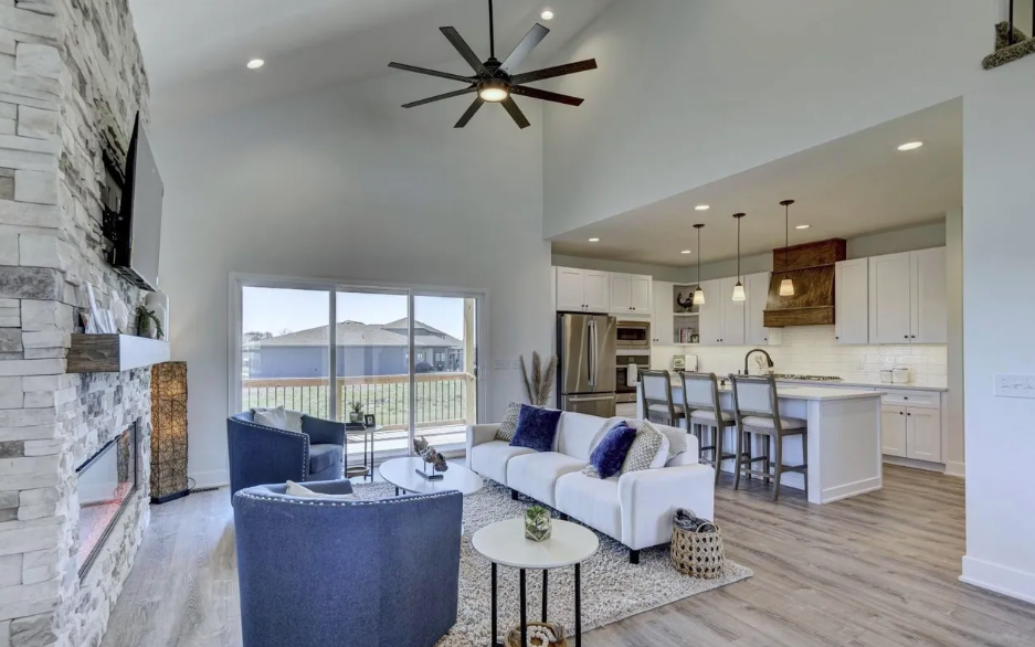 Open-concept custom living room and kitchen in a new construction home.