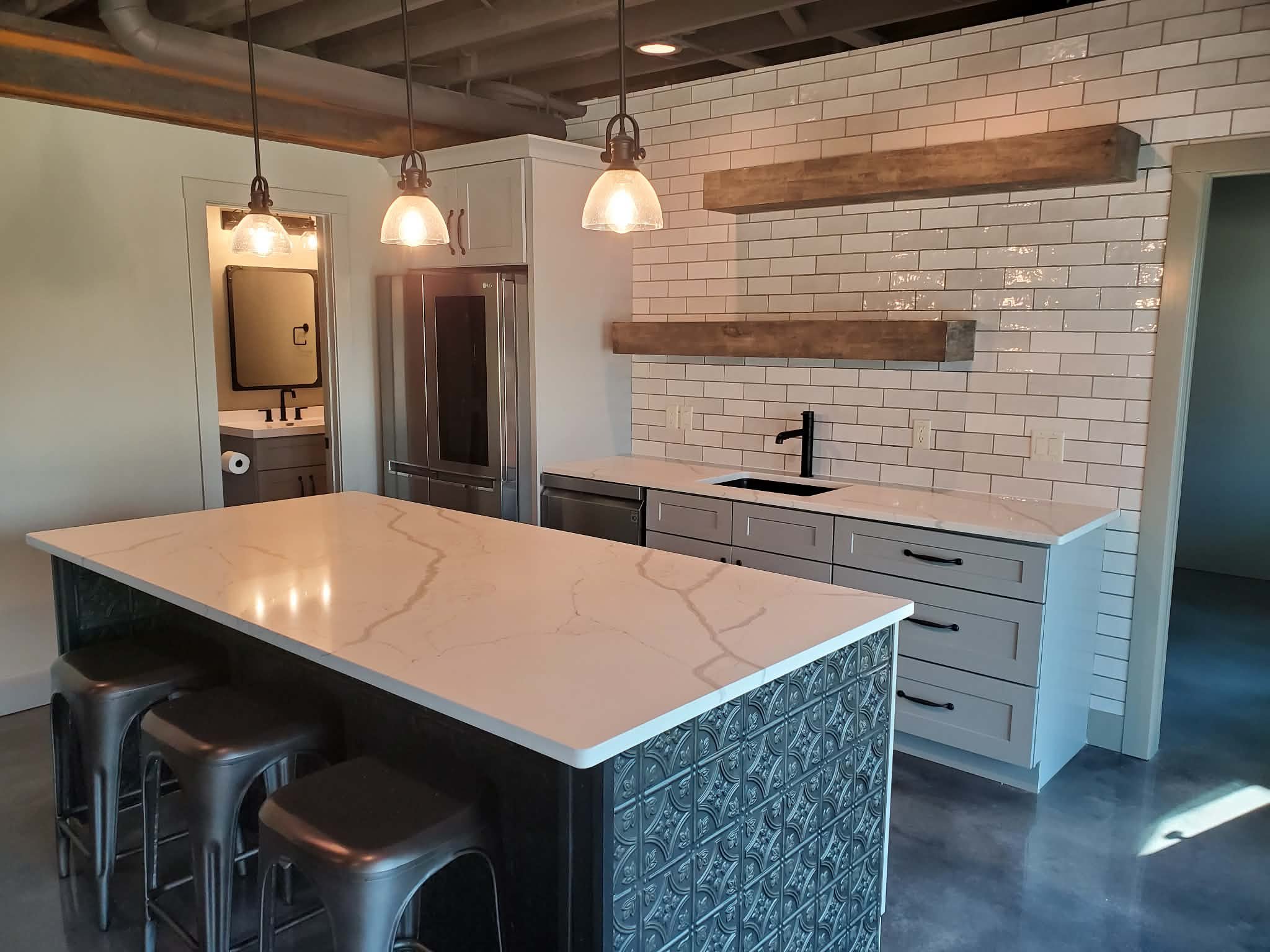 Finished basement with bar area.