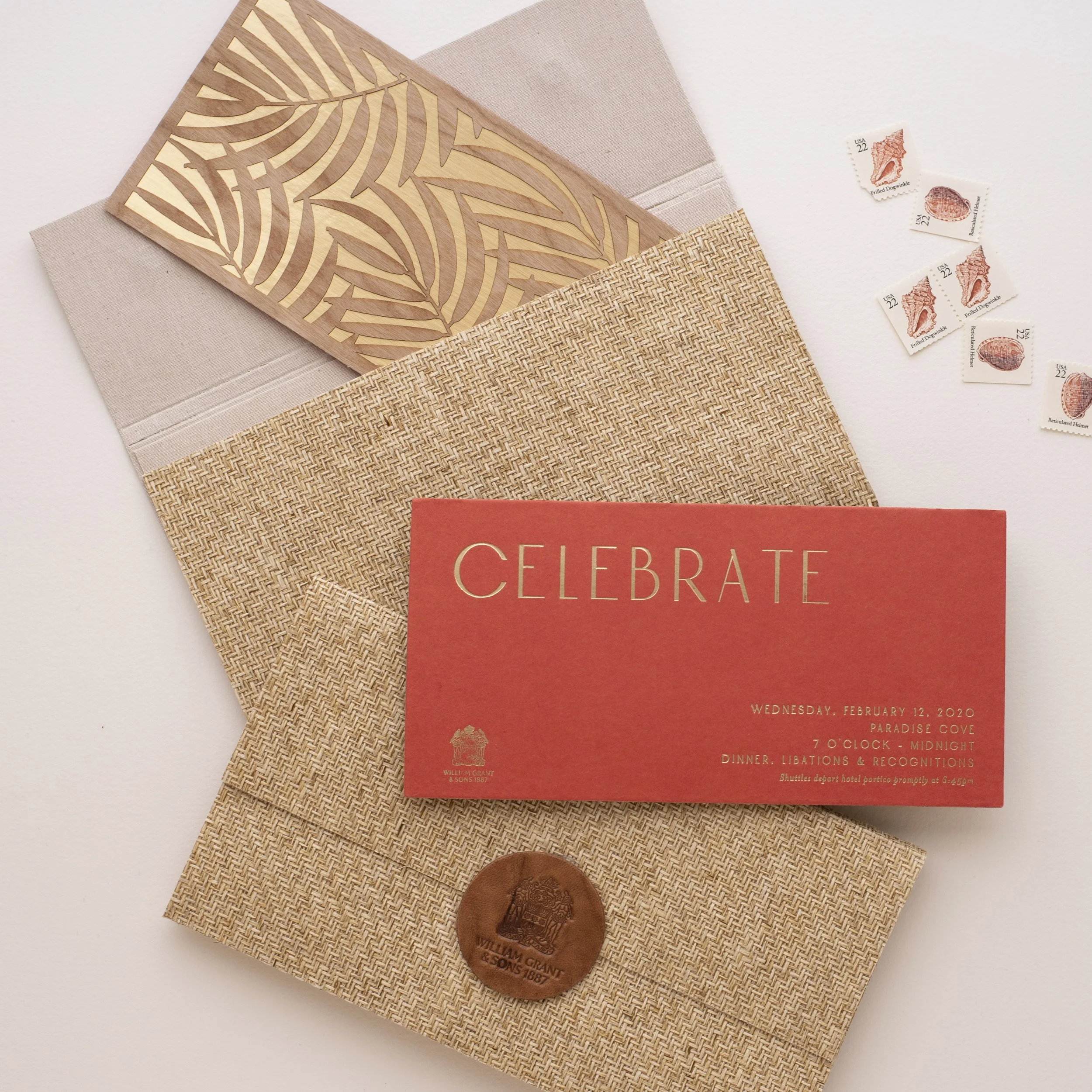 Gold foil invitation with texture rattan folio and leather embossed closure 