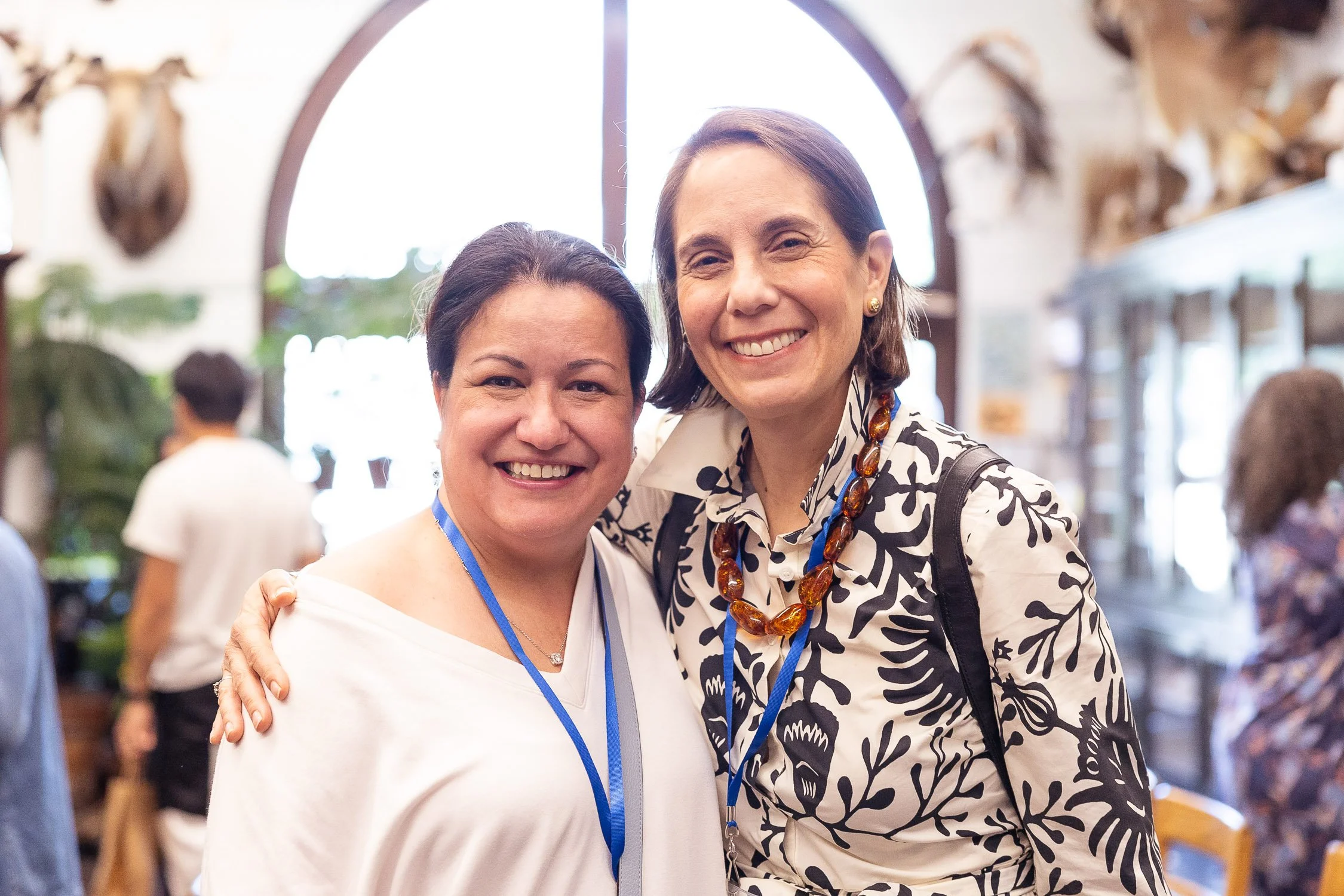 Two women smiling at the nature lab at the RISD reunion.
