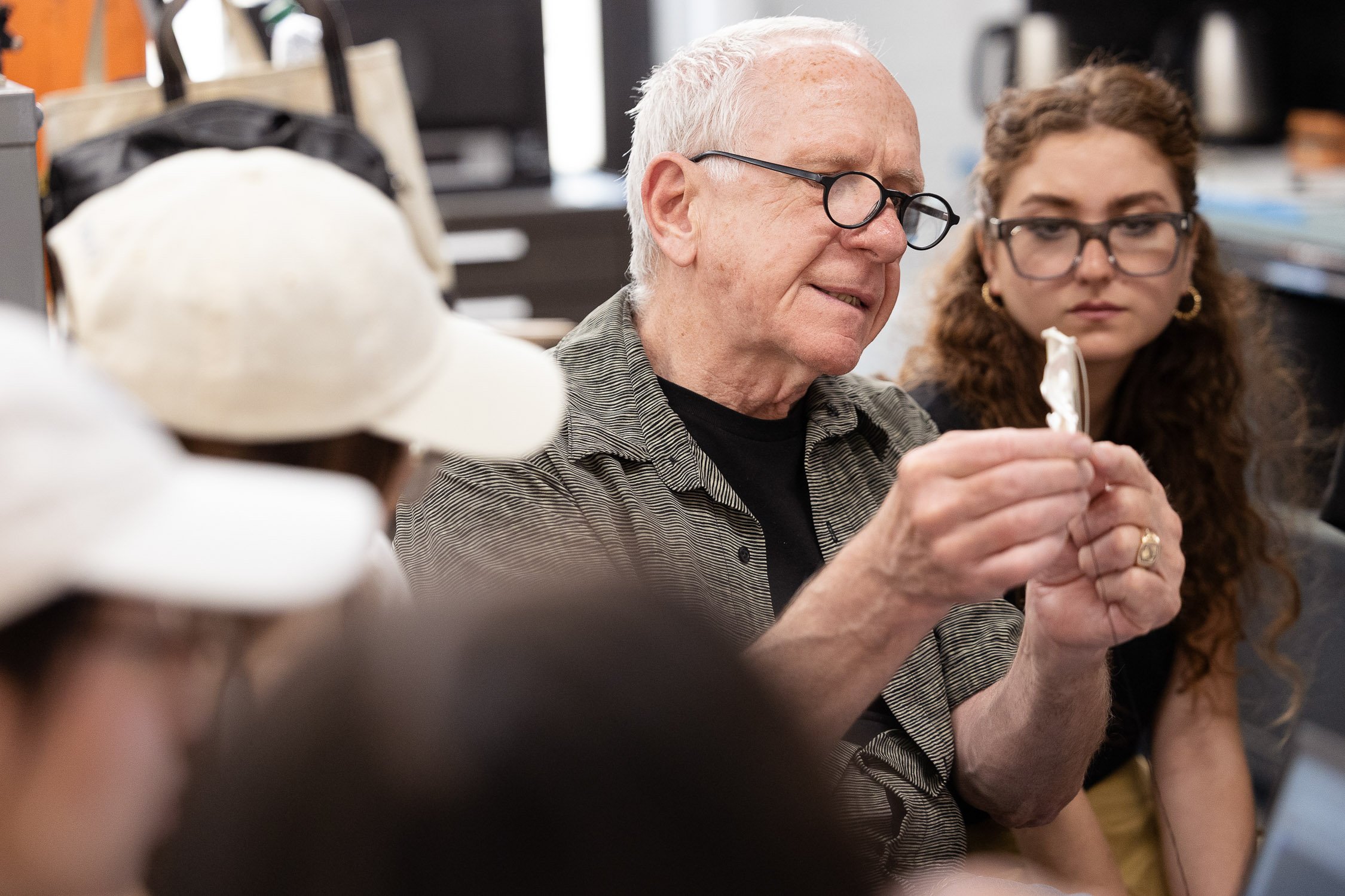 An jewelry making instructor something to a group of art students at the Rhode Island School of Design.