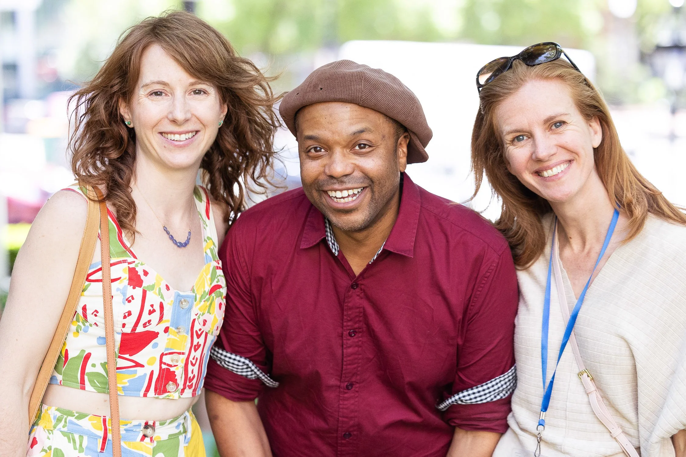 Three smiling people at a college reunion in Providence, Rhode Island..