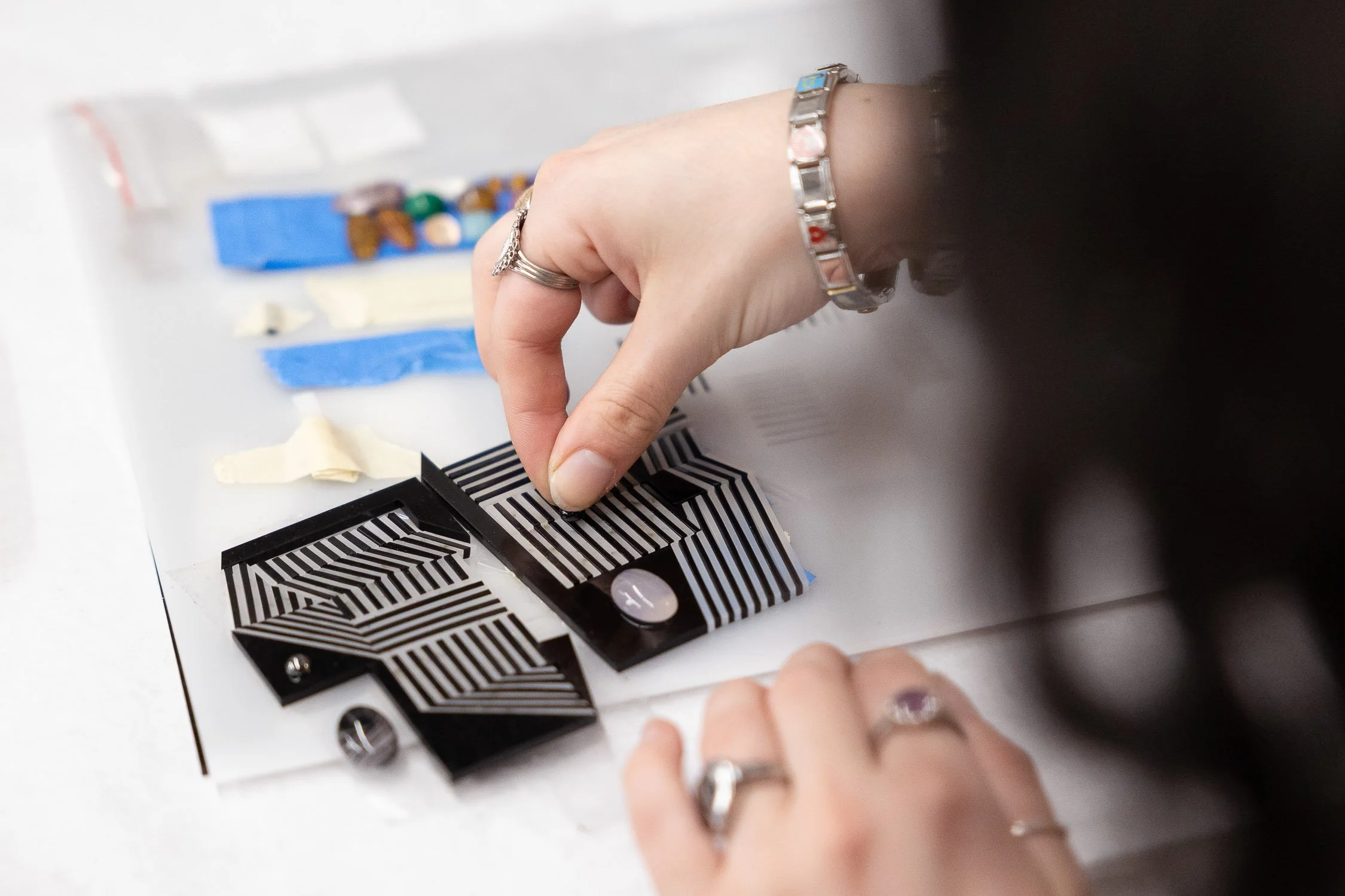 Person making earrings at Rhode Island School of Design.