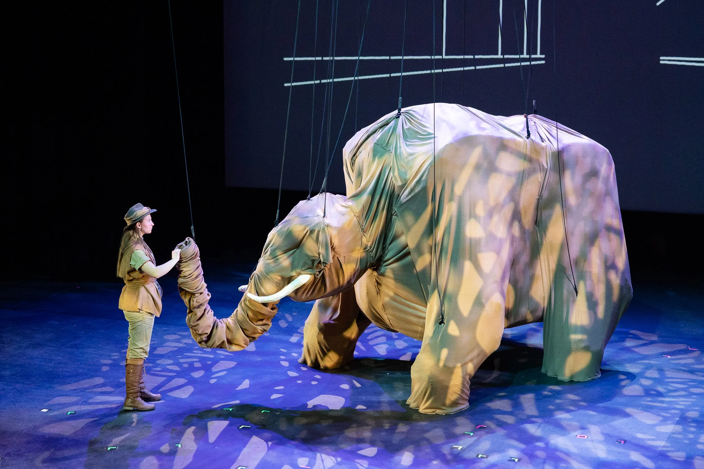 Girl on Stage with Puppet in The Impracticality of Modern Day Mastodons