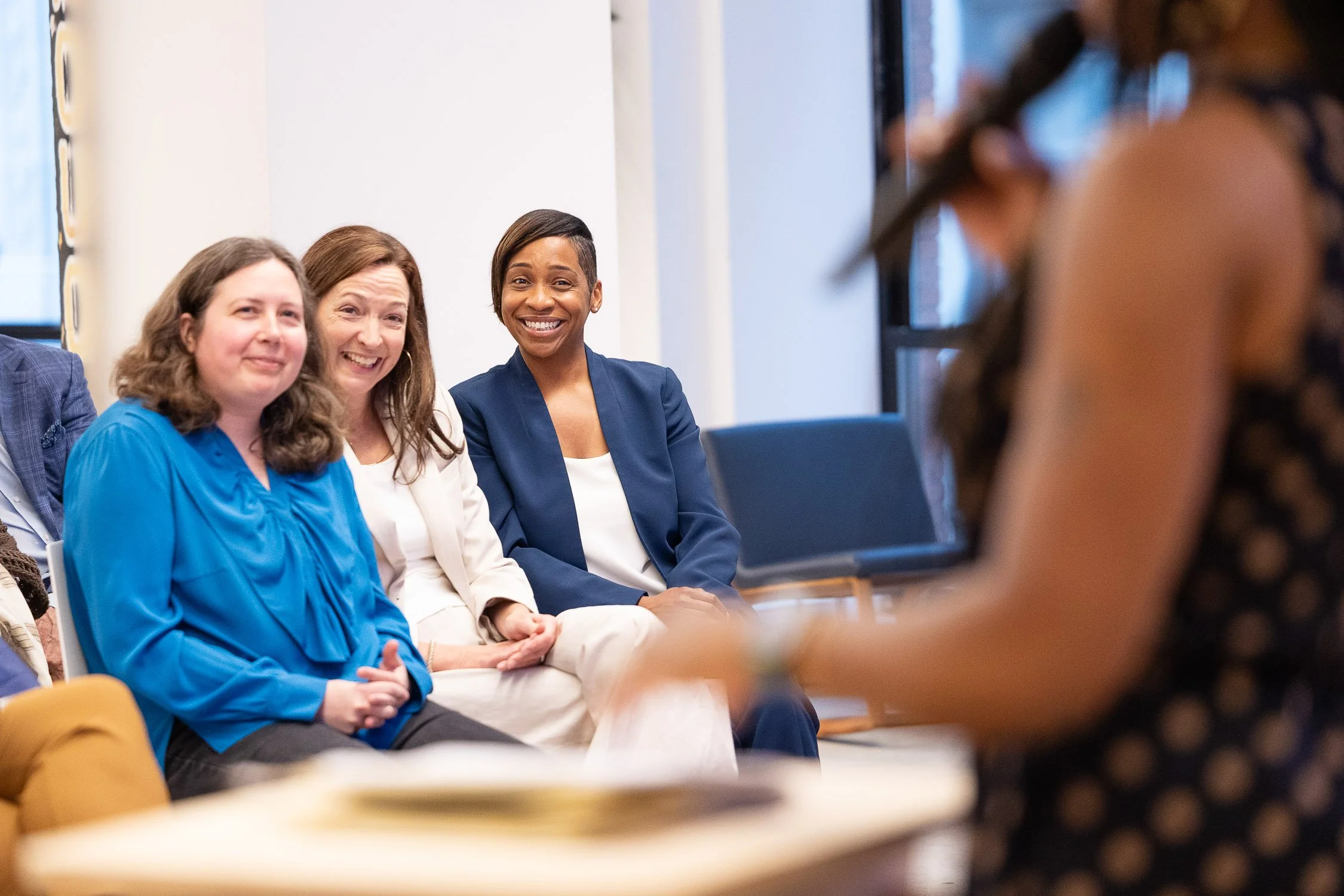 Massachusetts Attorney General Andrea Campbell seated and smiling at an event at Sasaki Foundation building in Boston.
